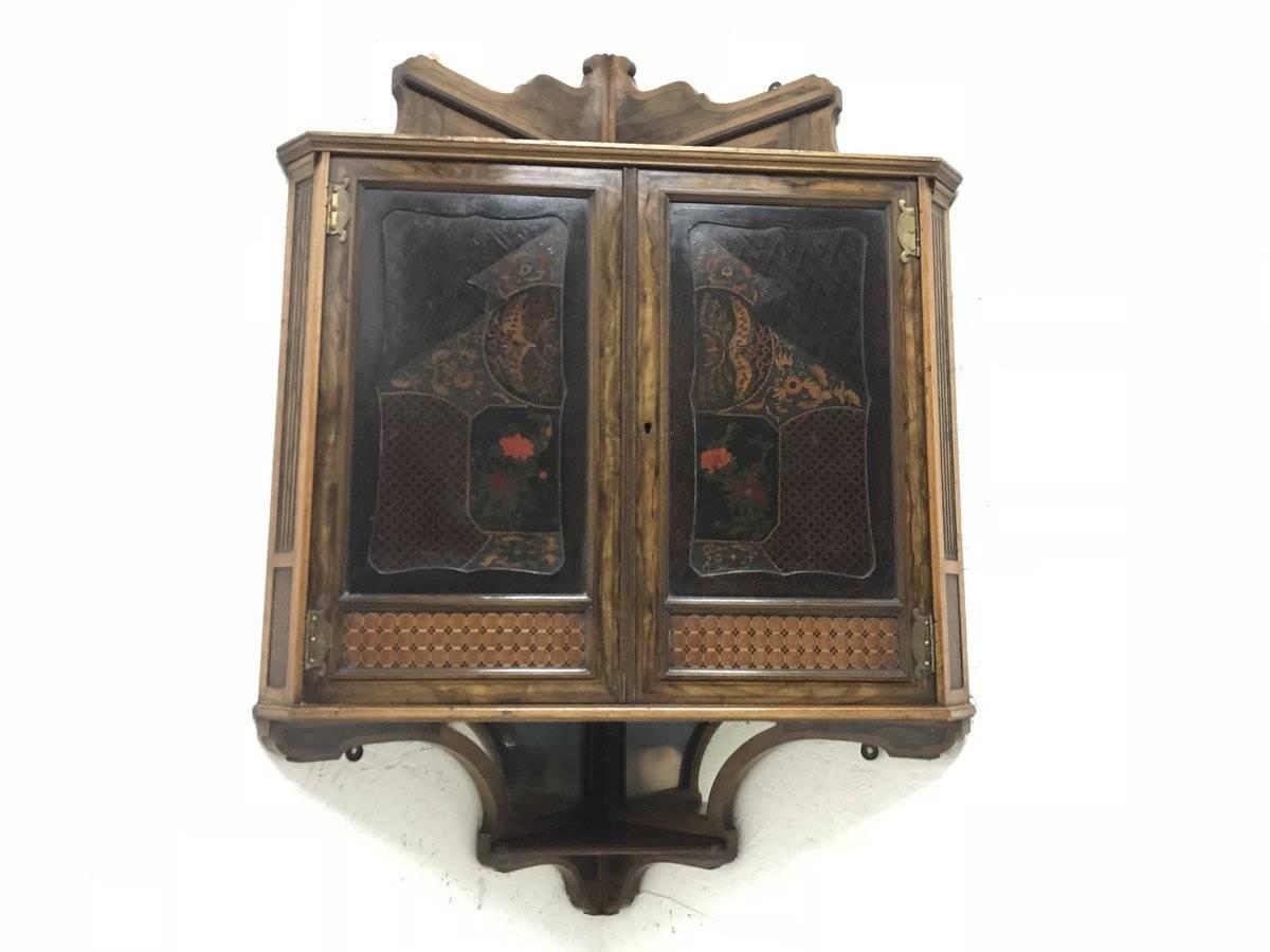 Thomas Jeckyll attributed, for William Henry Tate 1842-1922.
Gillows & Co of Regent St. London., 
An Anglo-Japanese corner cupboard with open upper shelf and exquisite Marquetry door panels with opposing butterflies and various Japanese style