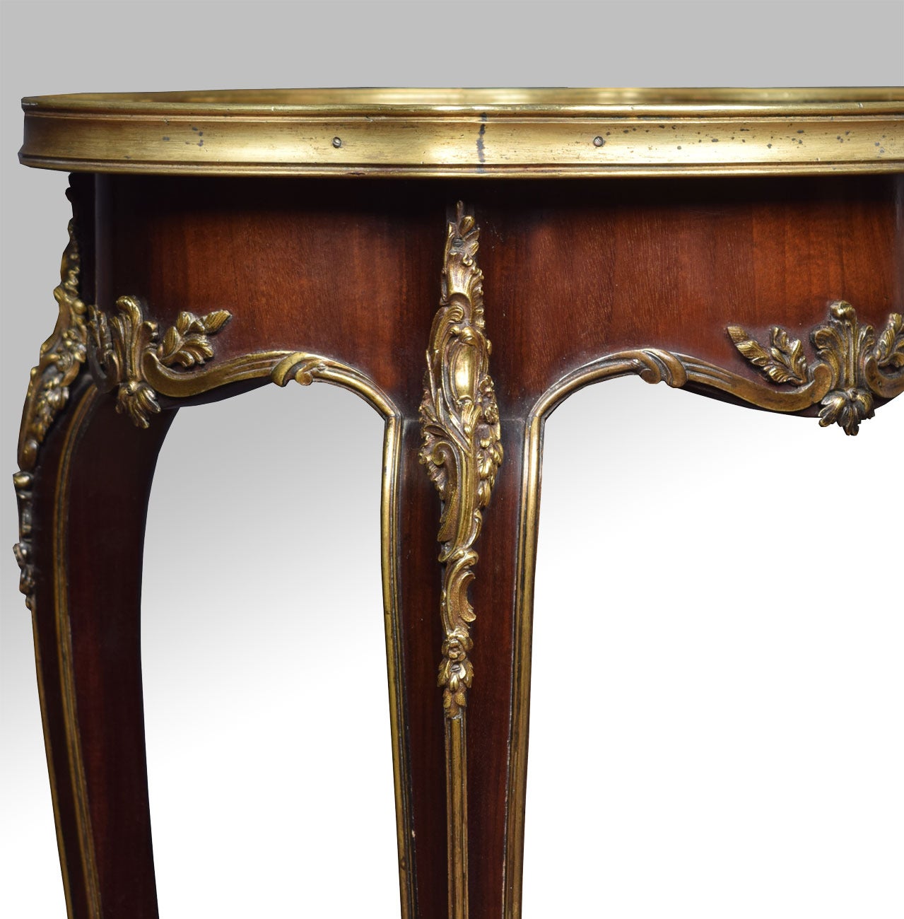 Gillows gilt bronze-mounted walnut table the inlaid to of oval form, raised up on four slender cabriole legs with gilt bronze-mounted sabots (Stamped Gillows to the underneath)

Dimensions:

Height 28.5 inches

Length 16 inches

Width 14