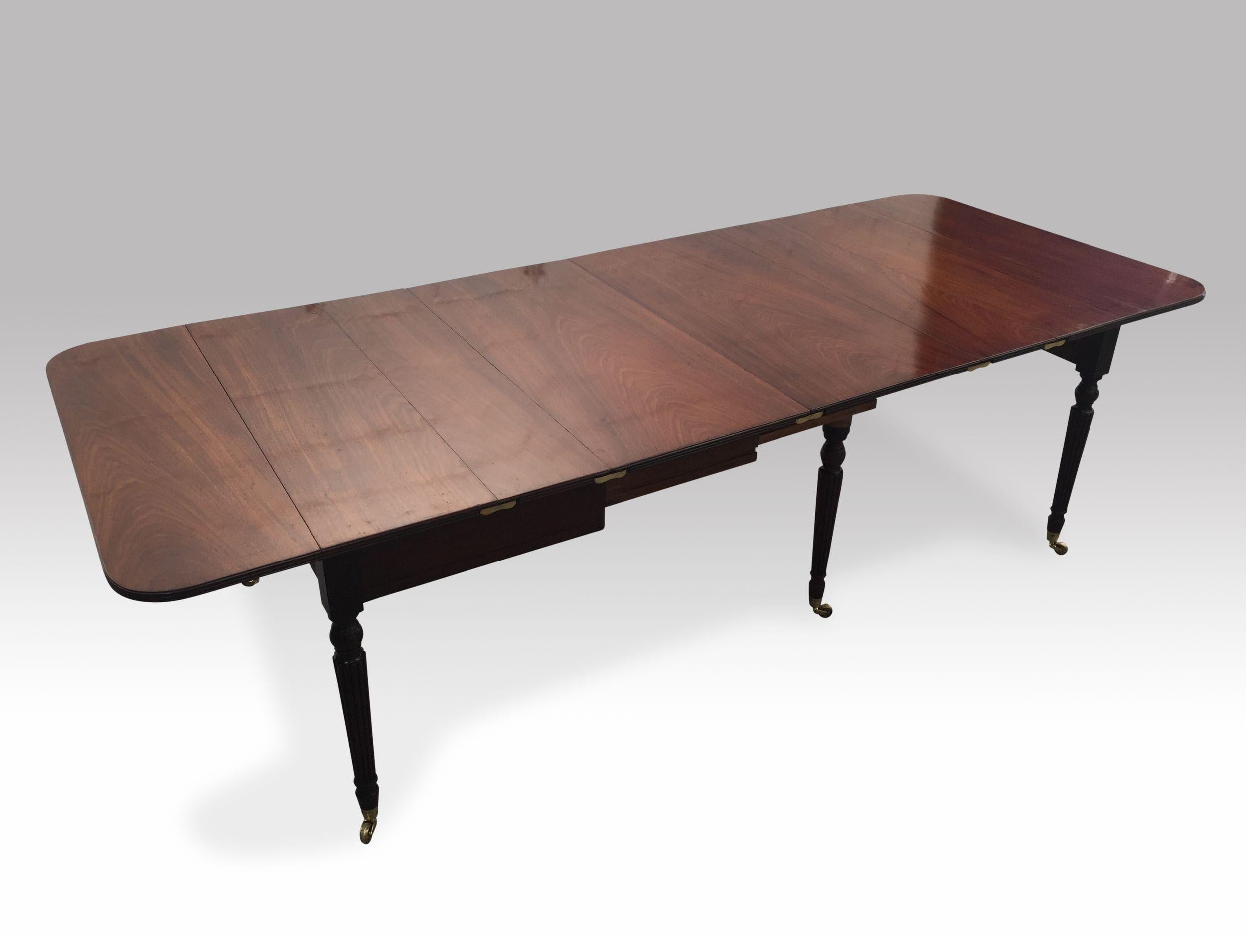 A superior quality extending mahogany dining table firmly attributed to Gillows and conforming precisely to a design in the Lancashire pattern books dated 1804. The reeded-edge top consisting of two hinged ends attached to short beds which join