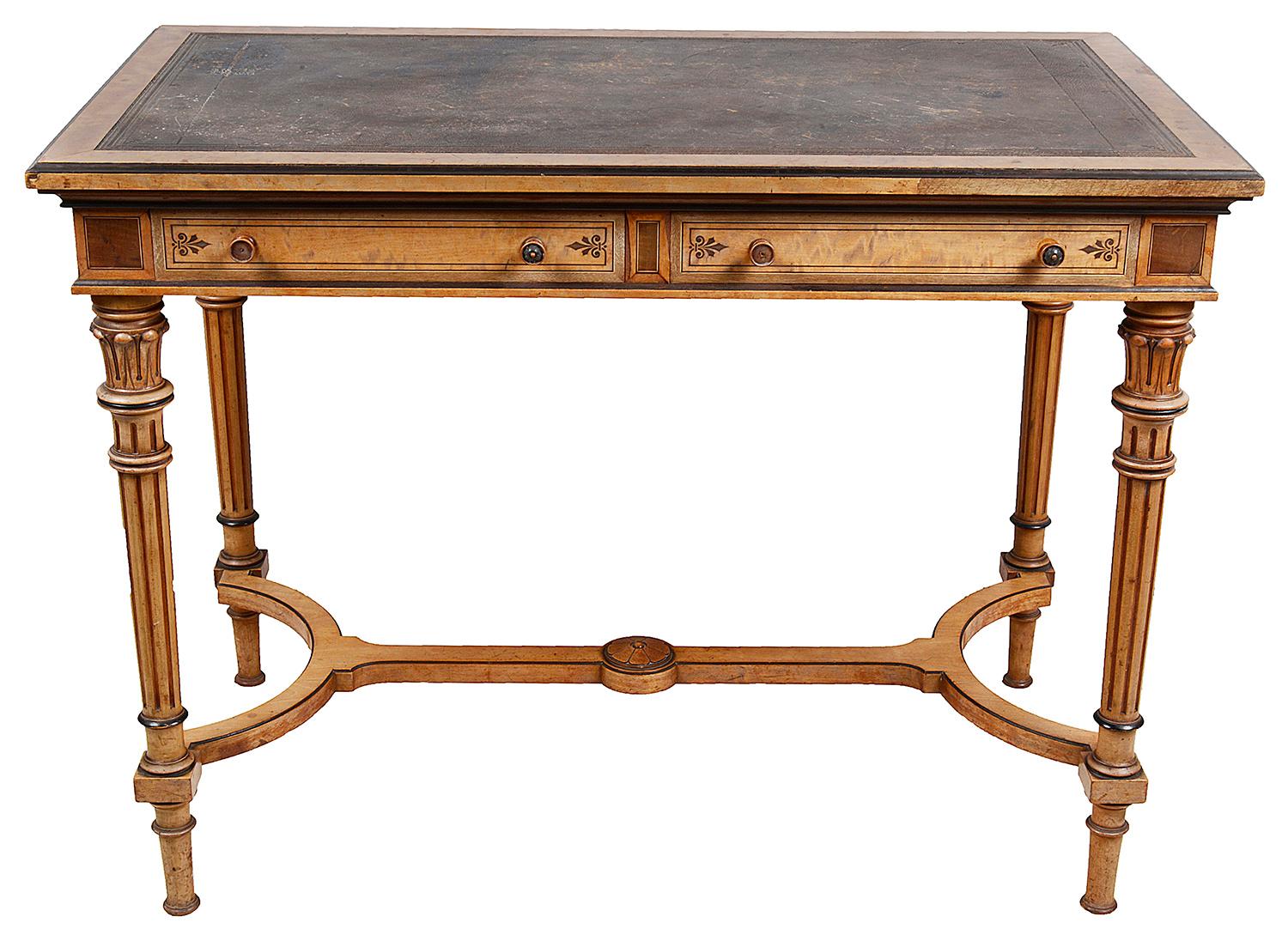 A very good quality 19th century Satin Birch inlaid library writing table, having an inset leather top, two frieze drawers, mahogany lined, stamped 'Gillows', raised on wonderful turned tapering carved and fluted legs, united by a stretcher between.