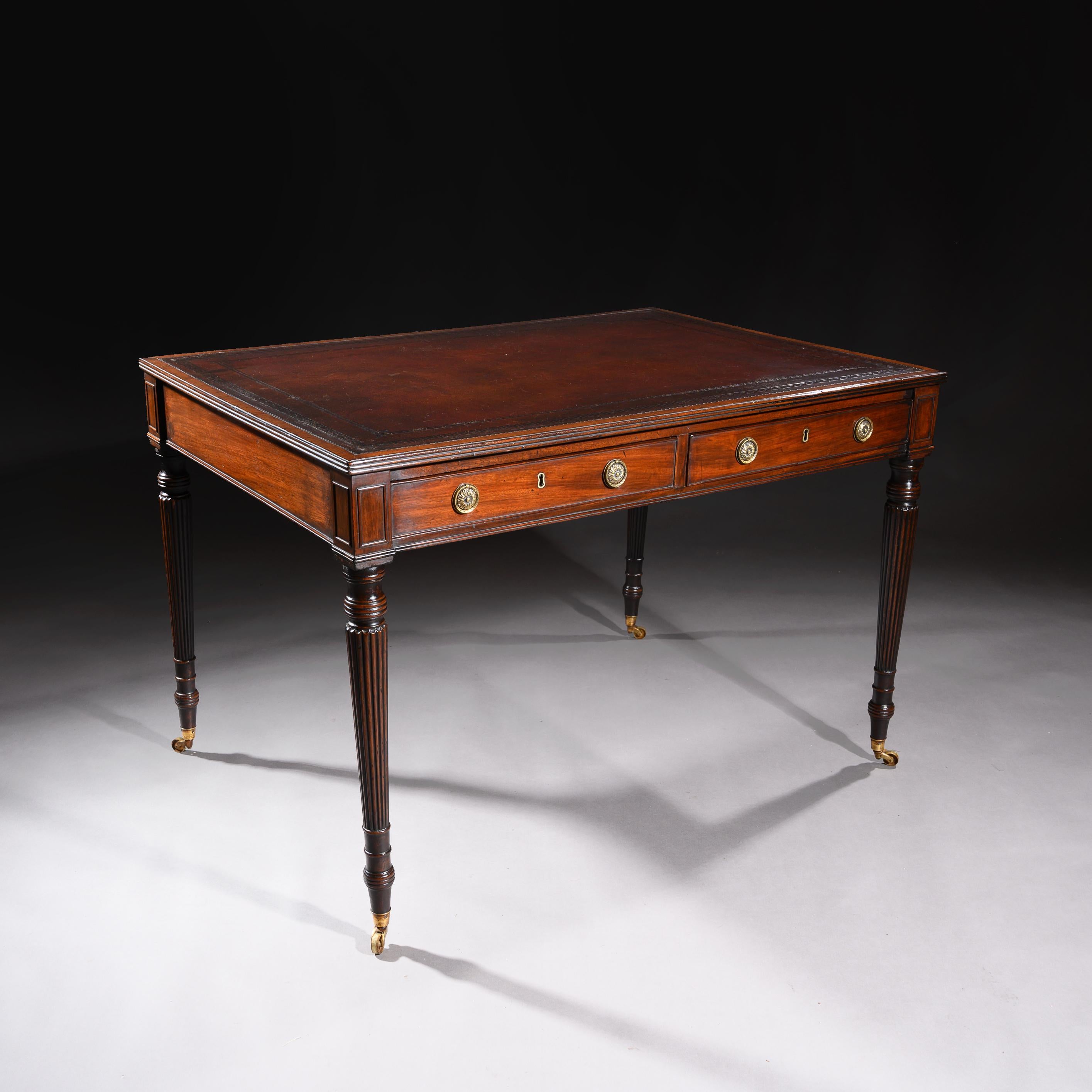 A late George III mahogany partners library writing table stamped ‘Gillows.Lancaster’.

English, circa 1800.

The rectangular top inset with a Greek key blind tooled leather inset writing surface, enclosed by a narrow crossband and reeded edge,