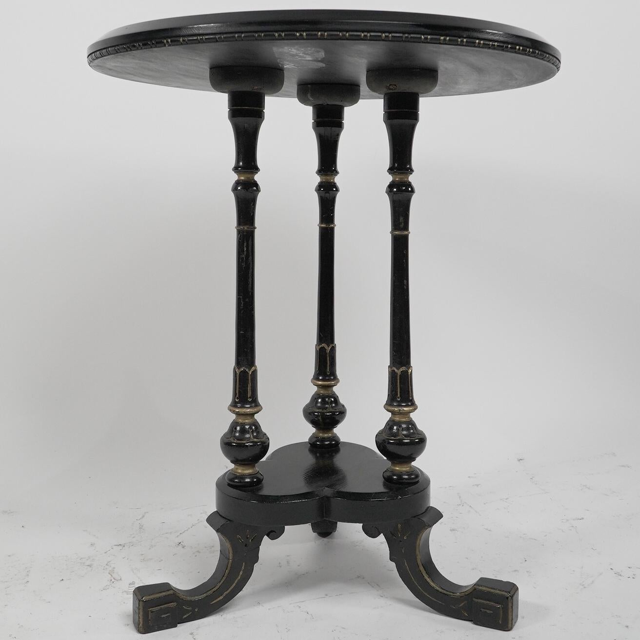 English Gillows of Lancaster An Aesthetic Movement ebonized circular side table For Sale