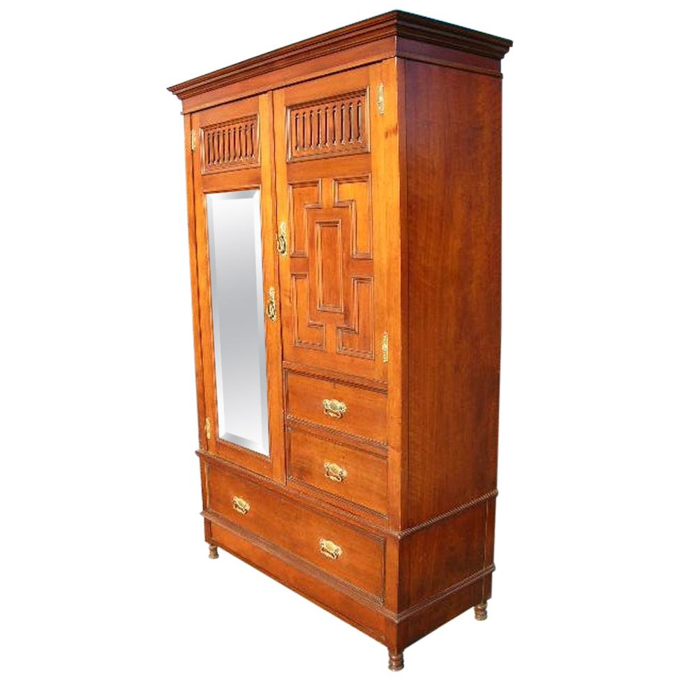 Gillow's of Lancaster, an Aesthetic Movement Walnut Armoire Wardrobe Compactum