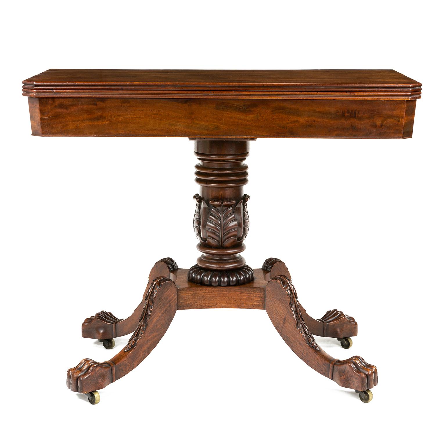 A fine quality rosewood Regency tea table accredited to Gillows, on a quatrefoil base with down swept legs decorated with acanthus leaf decoration, terminating in lion paw feet and castors.

Gillows of Lancaster and London, also known as Gillow &