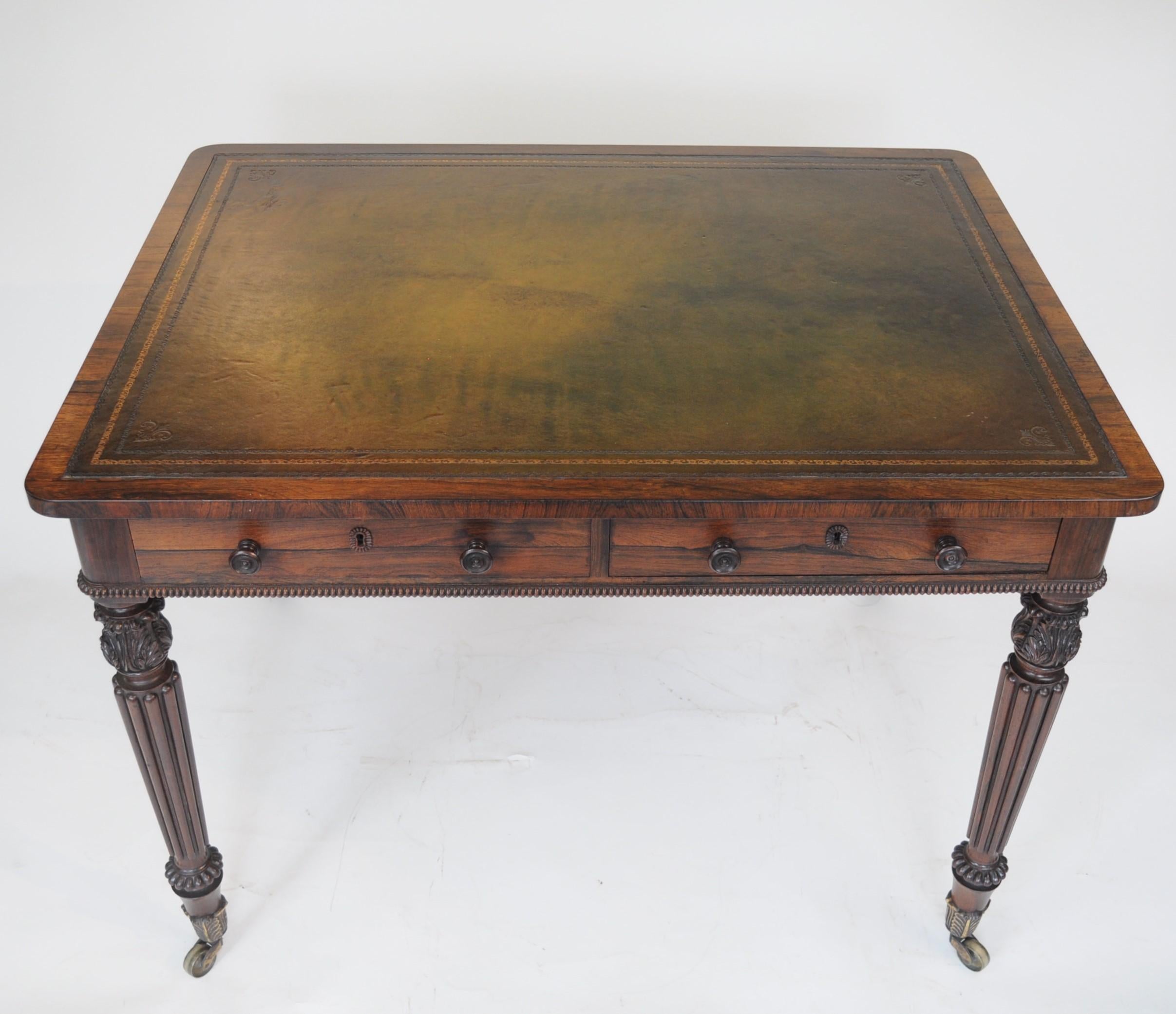 Attributed to Gillows of Lancaster
A superior quality rosewood Library or writing table with inset leather top above a plain apron fitted with two drawers to one side and opposing dummy drawers, standing on turned and reeded legs with very well