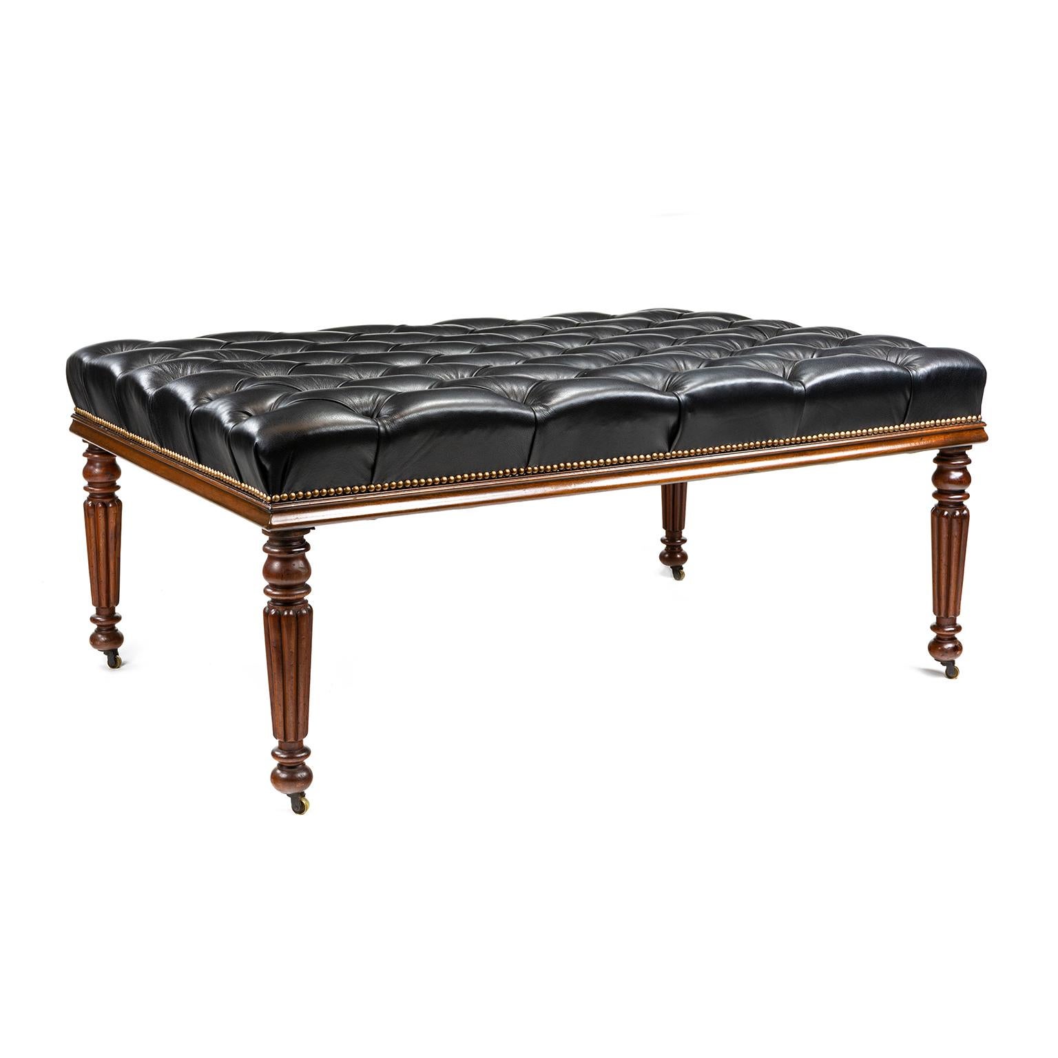 Large Gillows style foot rest or otterman, 20th C, the legs are original Gillows patern, covered in deep buttoned black leather on a mahogany frame.

Gillows of Lancaster and London, also known as Gillow & Co., was an English furniture making firm