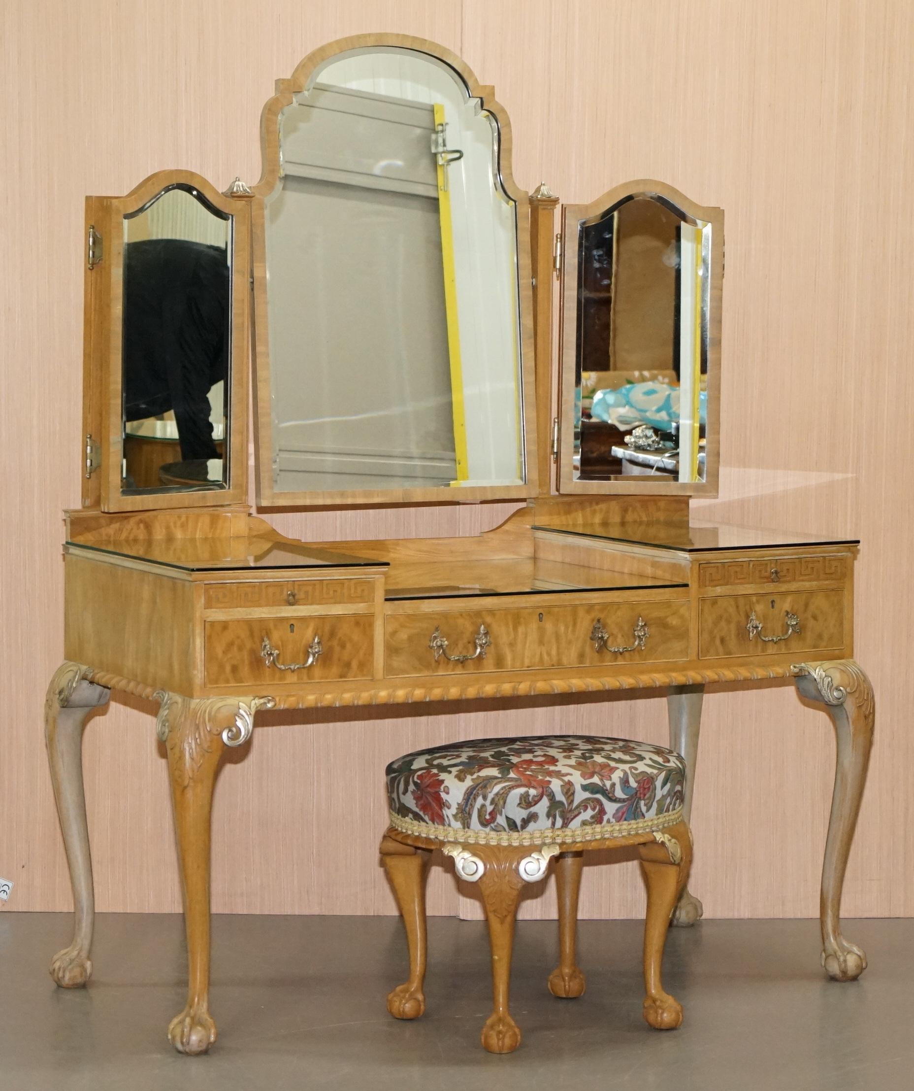 We are delighted to offer for sale this lovely Gillows Walnut Dressing table and stool with ornately carved Claw & Ball legs and folding mirrors

This dressing table has the Wearing and Gillows stamp inside the middle drawer

The table is a
