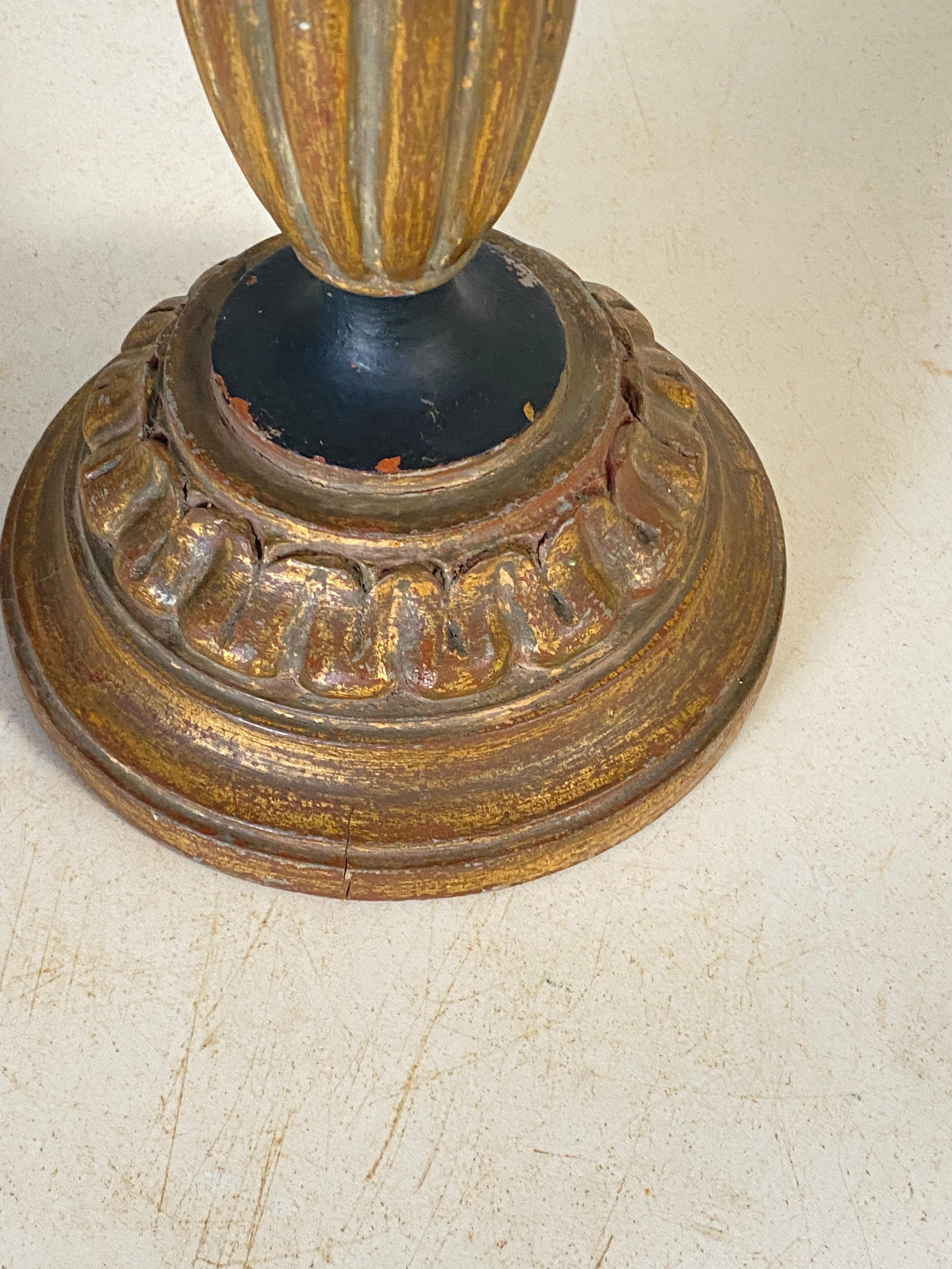 This candle holder or Candlestick  is in Wood with a gold color. It is heavy, and in a very good condition. The patina is beautiful.
It has been made in France in the 1950's.