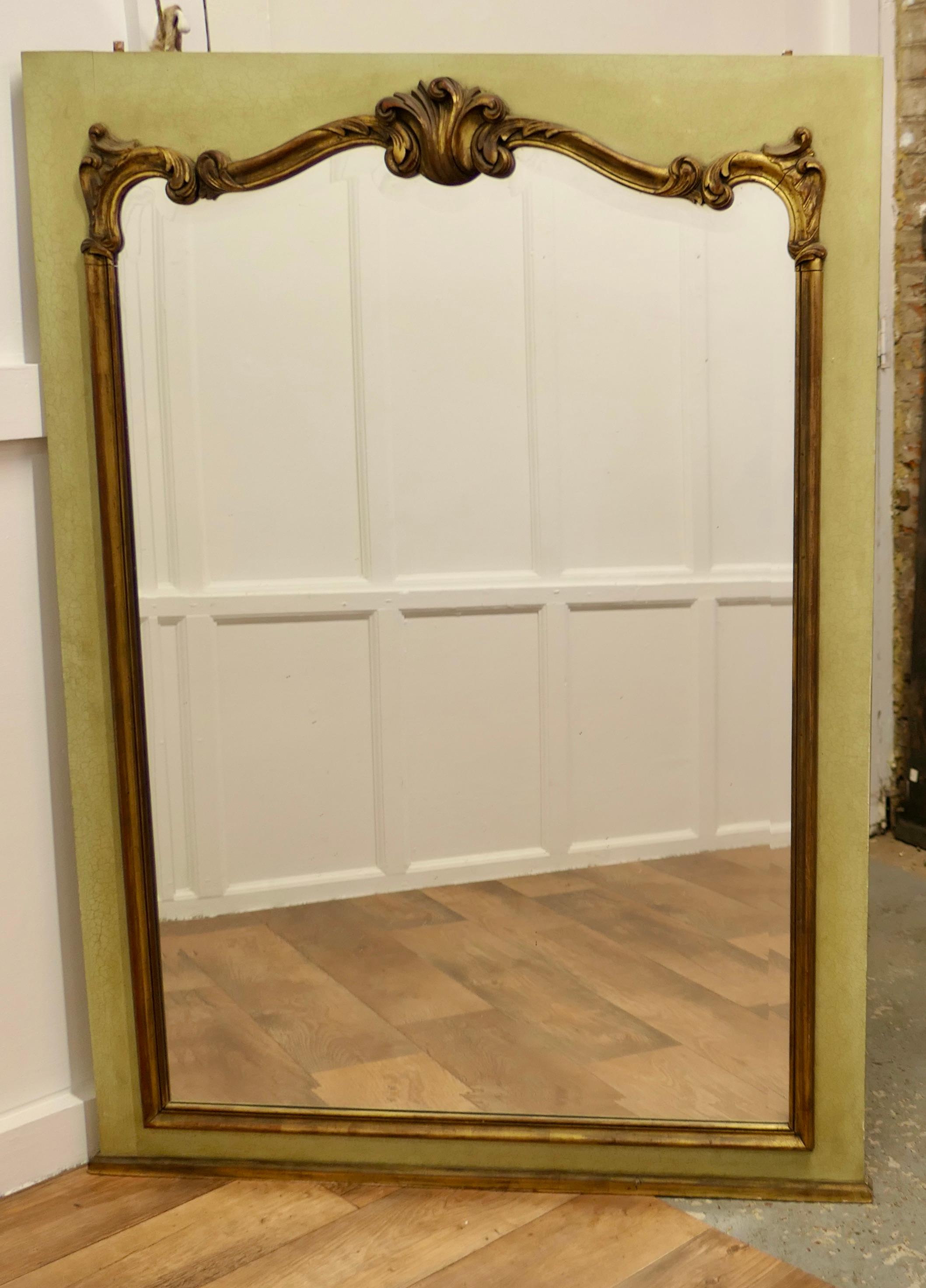 Gilt and Crackle Paint Mirror Mounted Wall Panel 

This French piece has been rescued from a 19th century panelled room
The panel has been set with a decorative gilt frame on crackle painted pale green/ yellow

The panel would work very well as