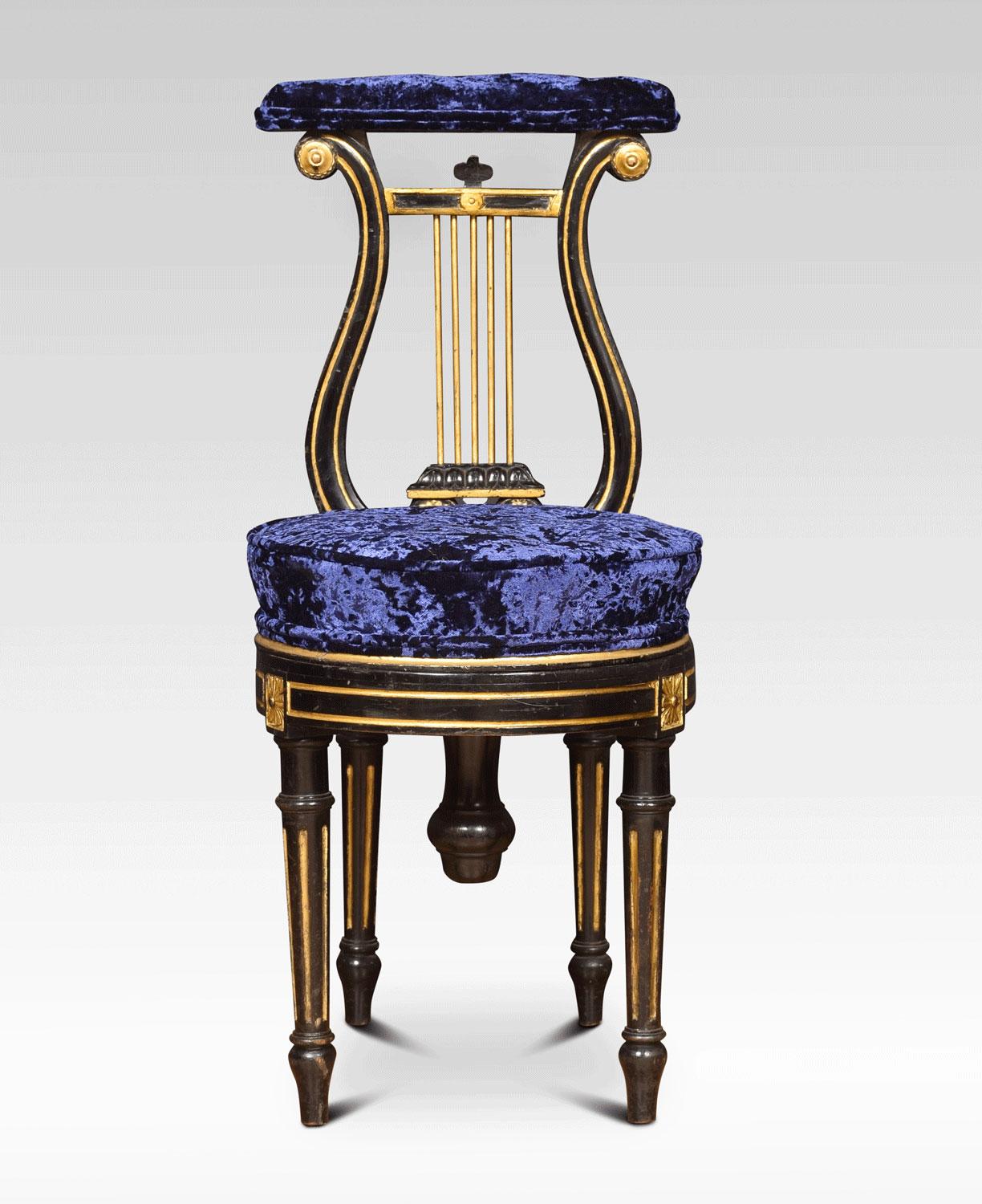 19th century music chair with buttoned upholstered top rail above ebonised and gilt lyre back. To the circular adjustable swivel seat, all raised up on tapered reeded supports.
Dimensions:
Height 34.5 inches height to seat 20 inches adjustable to