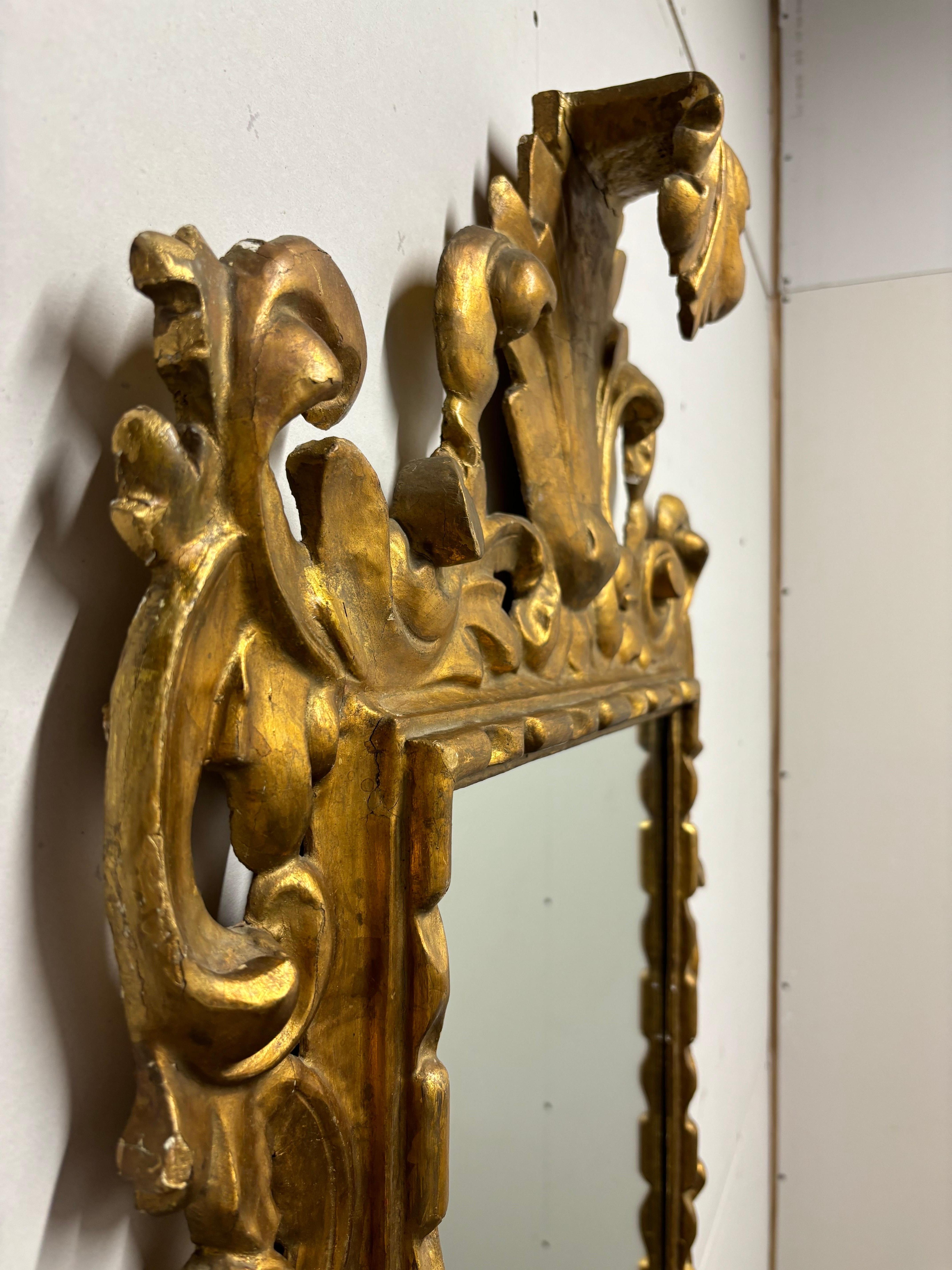 Gilt, Gesso on Wood Beautifully Done with a Sense of over the Top!  Overall in very nice Original Shape.  I think these mirrors look great over a modern console or antique!  Check out my other gilt mirror listings!