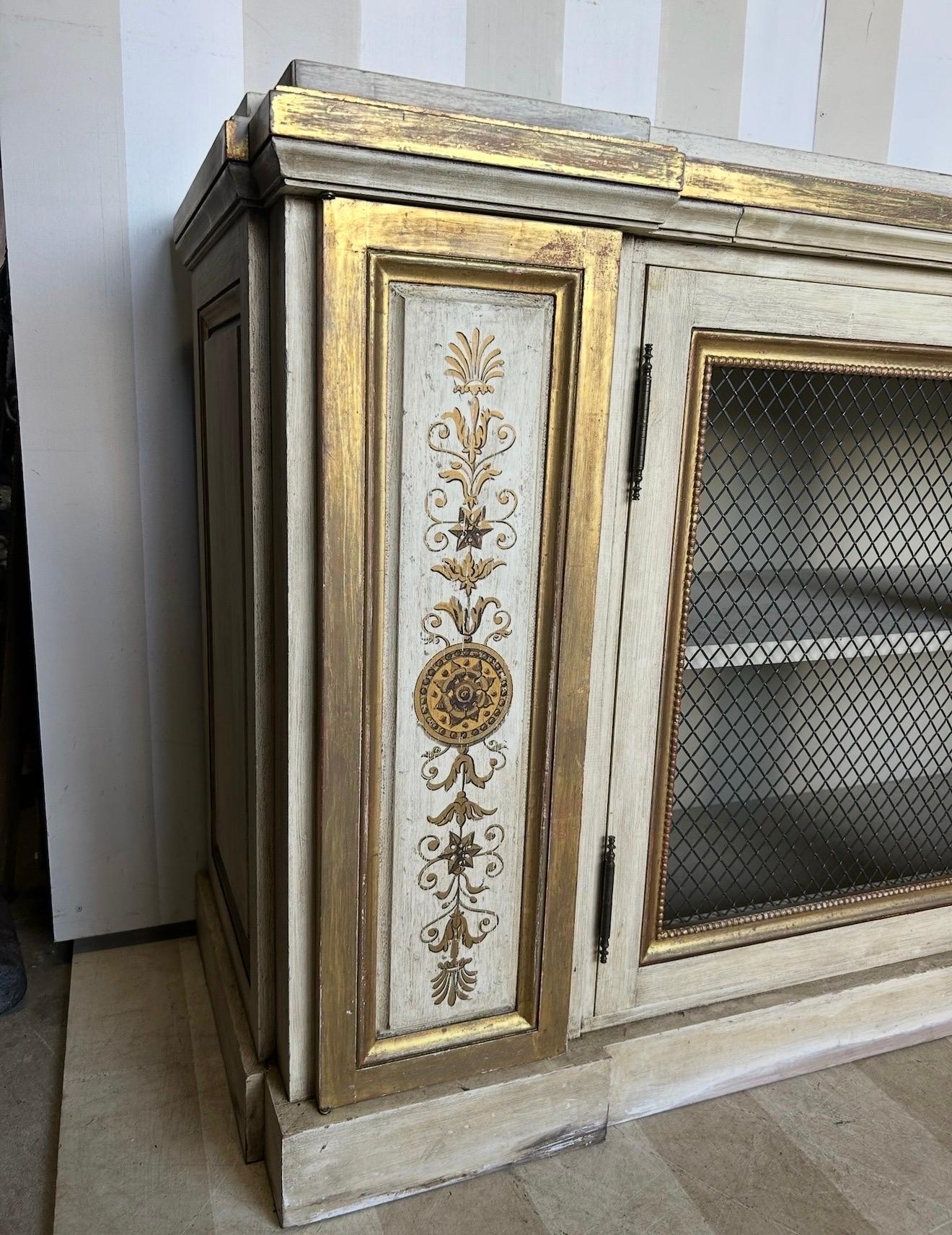 Unknown Gilt and paint decorated Neoclassical style cabinet from newel For Sale