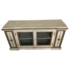 Gilt and paint decorated Neoclassical style cabinet from newel