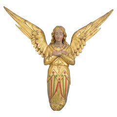 Gilt and Painted Carved Wooden Angel Wall-Sculpture, 19th Century Gilt and Painted Carved Wooden Angel Wall-Sculpture, 19th Century