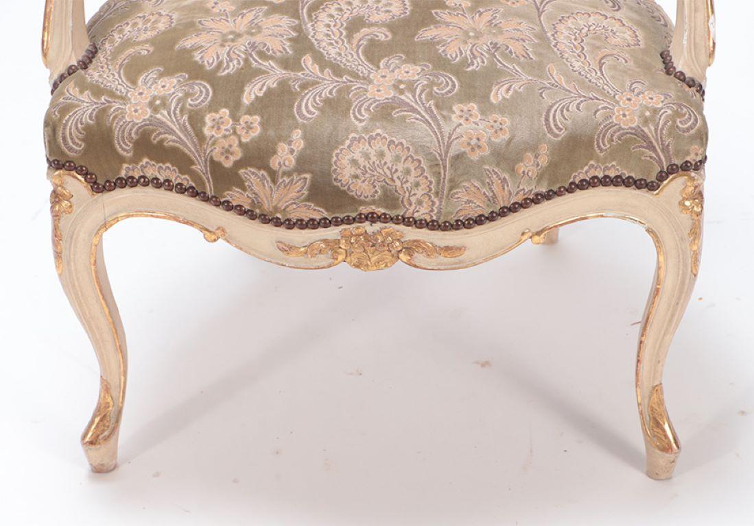 Upholstery Gilt and painted French upholstered open armchair in the Louis XV style. For Sale
