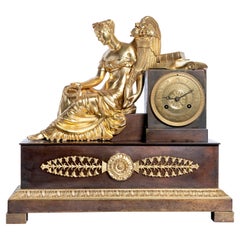 Reloj de chimenea de bronce dorado y patinado, máquina firmada L. Moinet, Francia