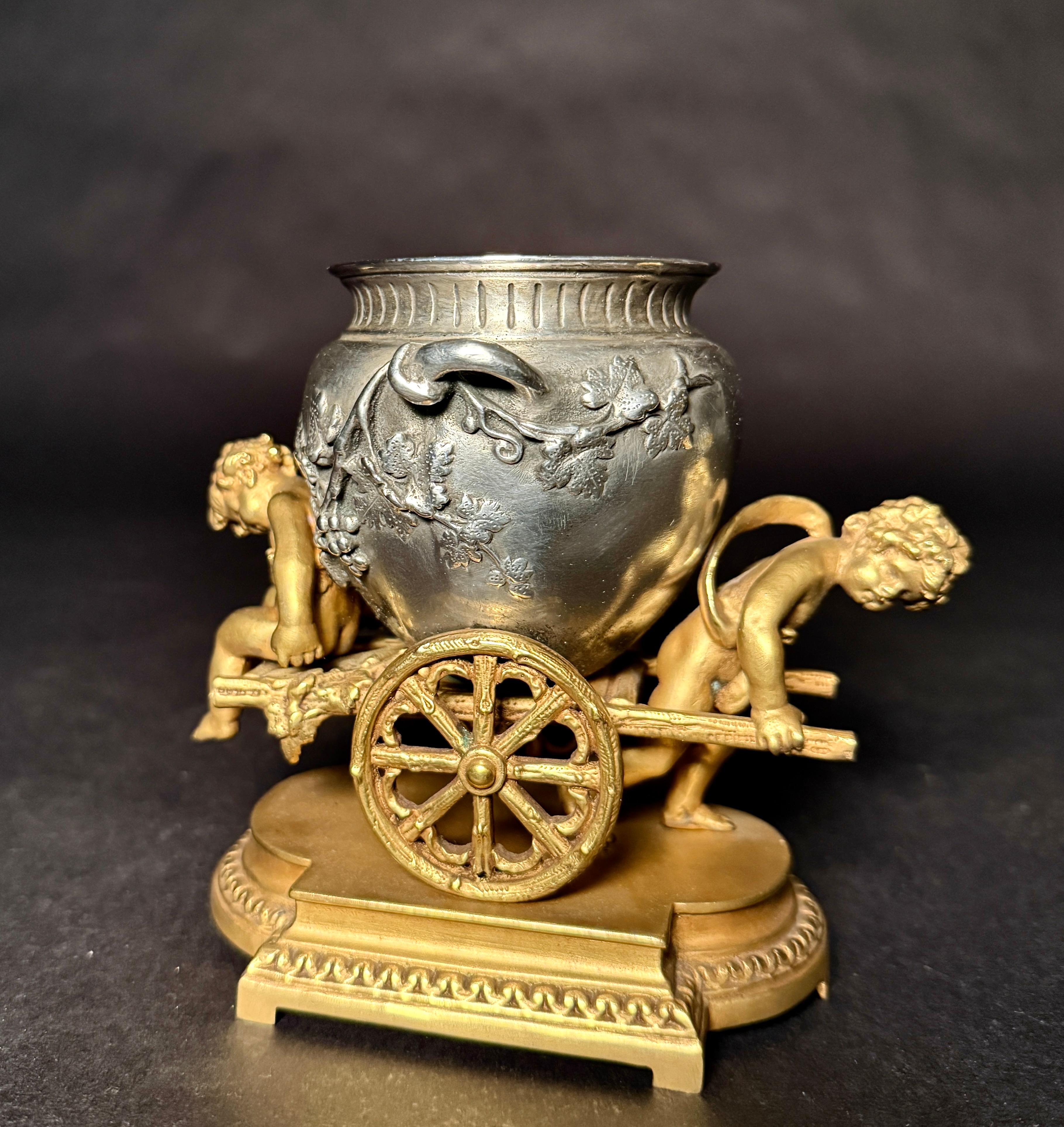 Louis XVI Gilt And Silvered Bronze Table Ornament With Putti And Urn For Sale