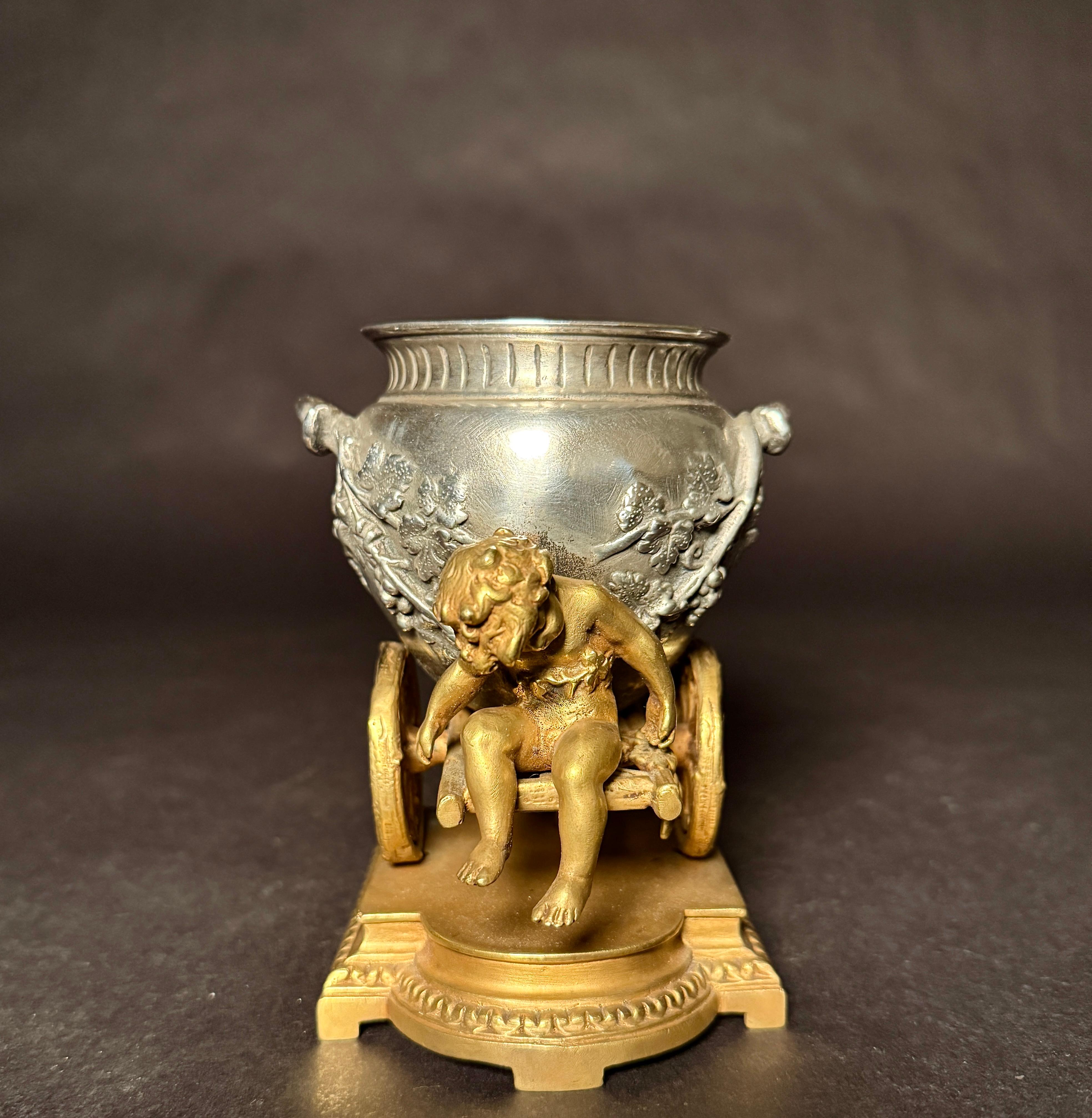Gilt And Silvered Bronze Table Ornament With Putti And Urn In Good Condition For Sale In Norwood, NJ