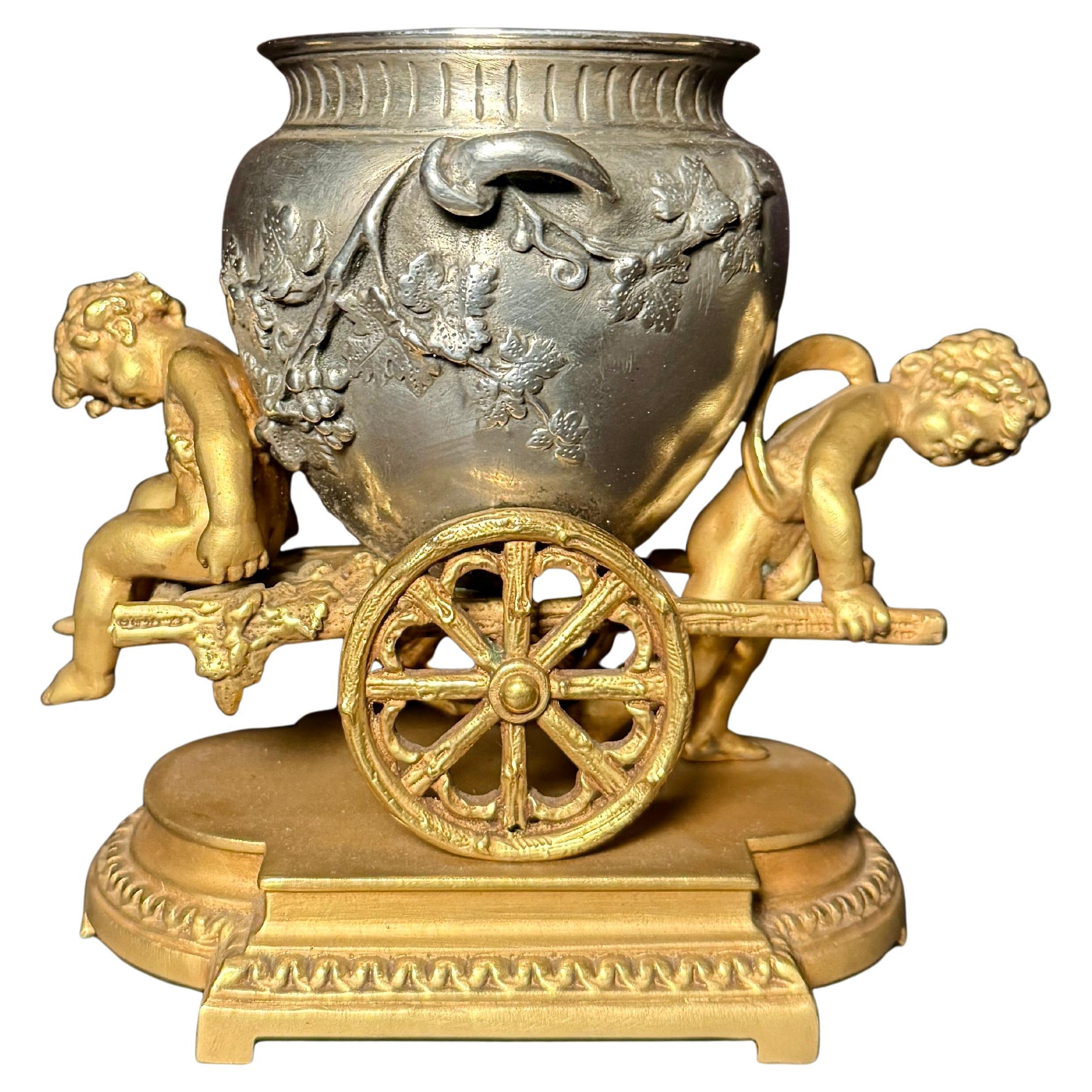 Gilt And Silvered Bronze Table Ornament With Putti And Urn For Sale