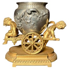 Gilt And Silvered Bronze Table Ornament With Putti And Urn