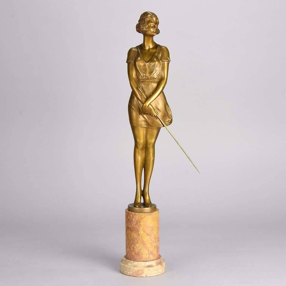 Fabulous Art Deco gilt bronze figure of a beautiful woman wearing a loose fitted figure hugging dress and high heels holding a riding whip, with excellent colour and very fine hand finished detail, signed Zach

Zach Riding Whip –  Bruno Zach