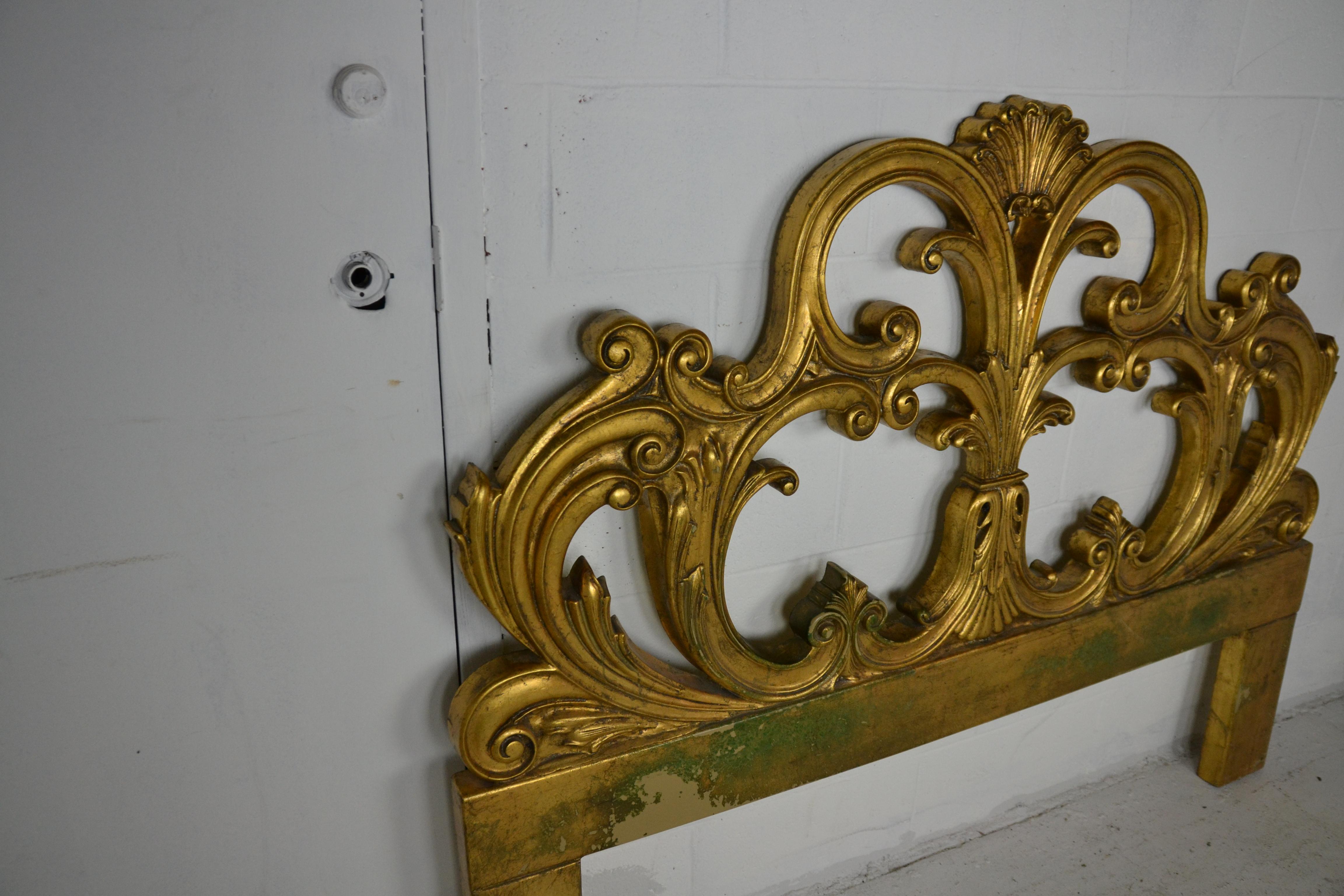 A gilded headboard decorated with scroll-work design. Acanthus leaf and shell motif.
Measures: Max width 60