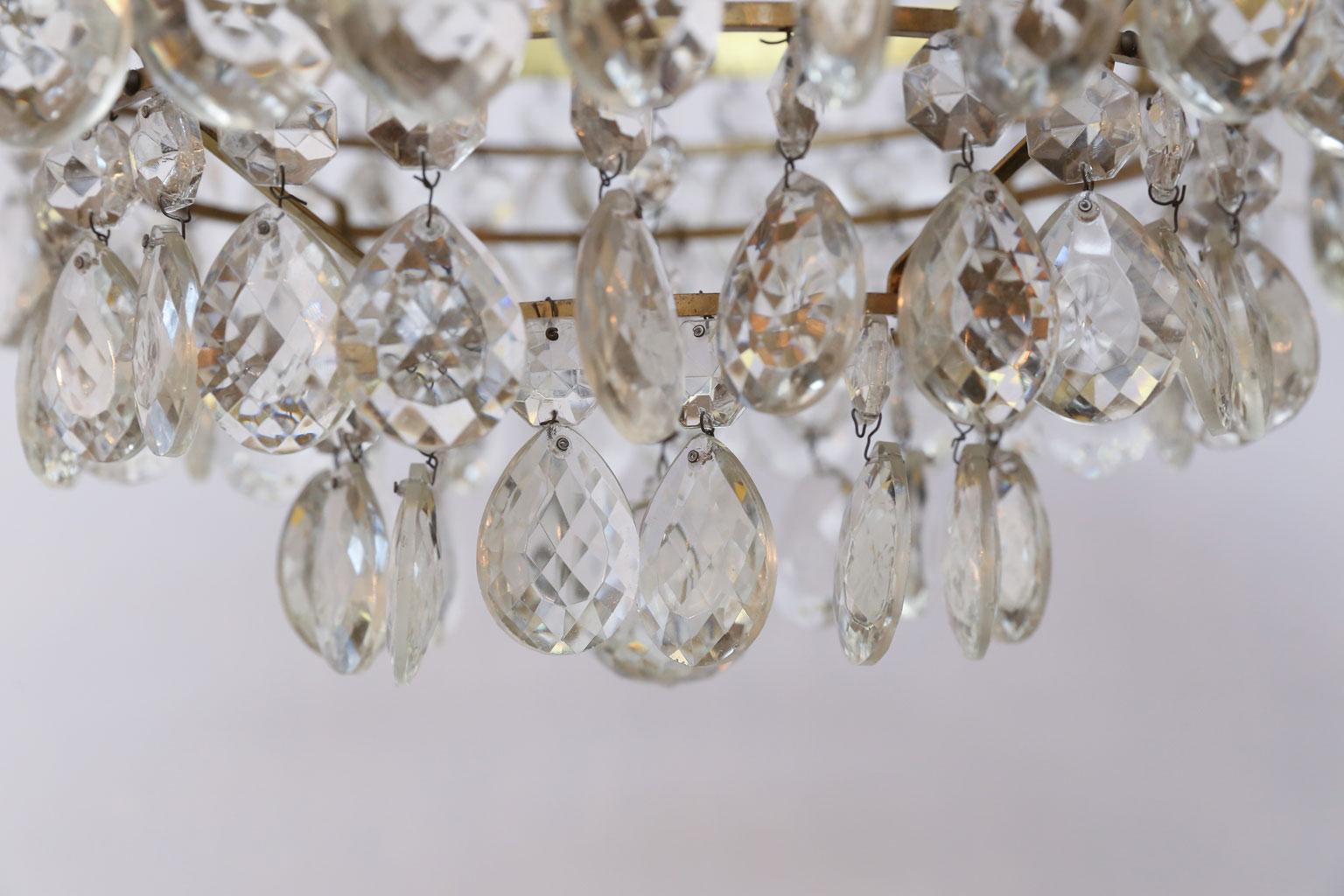 Hollywood Regency Gilt Brass and Crystal Mid century Modern Chandelier by Palwa with 4 Tiers