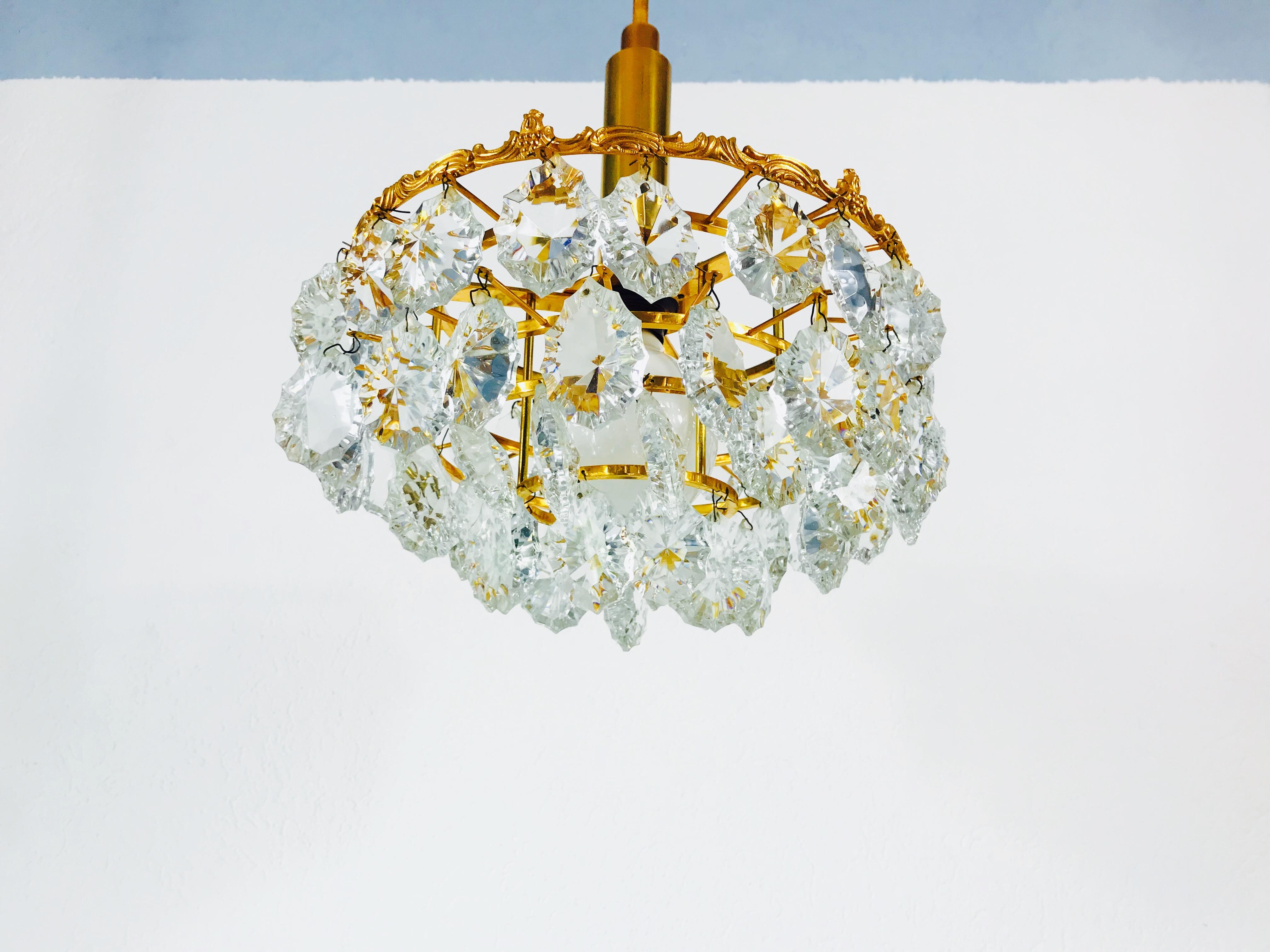 Late 20th Century Gilt Brass and Crystal Glass 4-Tier Chandelier by Palwa, Germany, 1970s For Sale