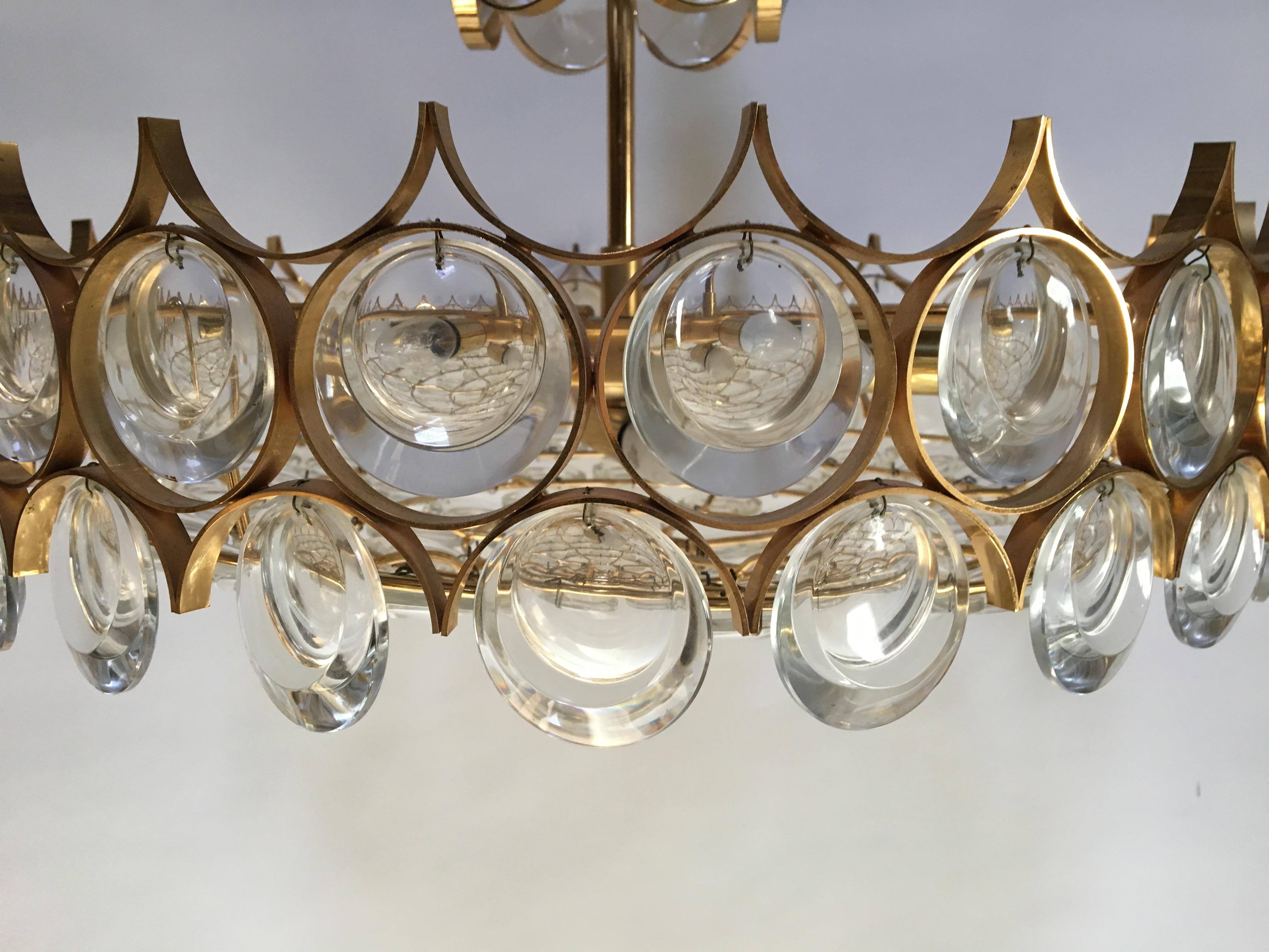 A gilt brass chandelier with multiple rings with glass by Palwa, German circa 1960's