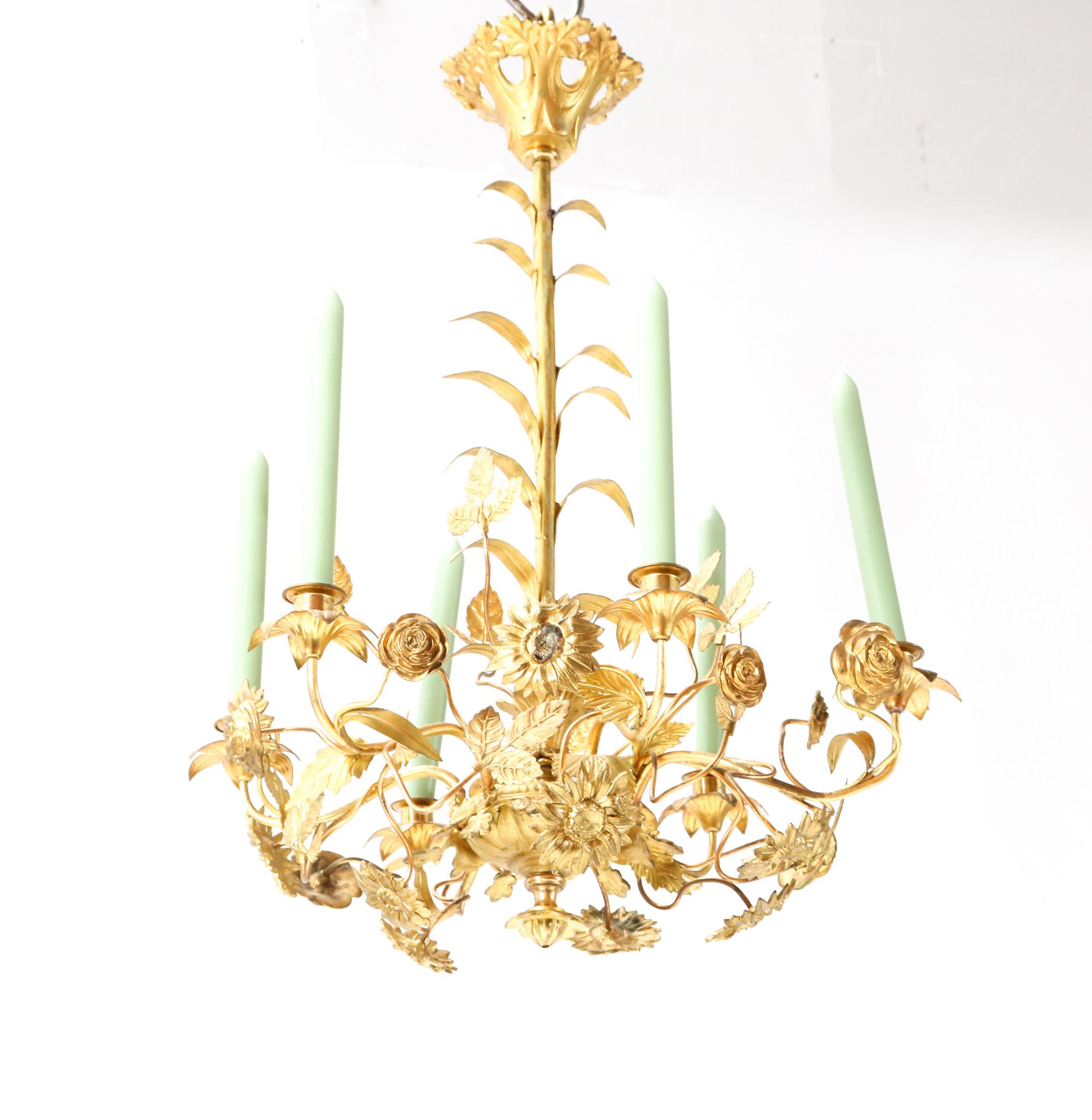 Stunning and rare Art Nouveau chandelier.
Striking French design from the 1900s.
Original gilt brass frame with original floral decorative elements.
Five original candle holders for candle light.
This wonderful Art Nouveau chandelier is in very good