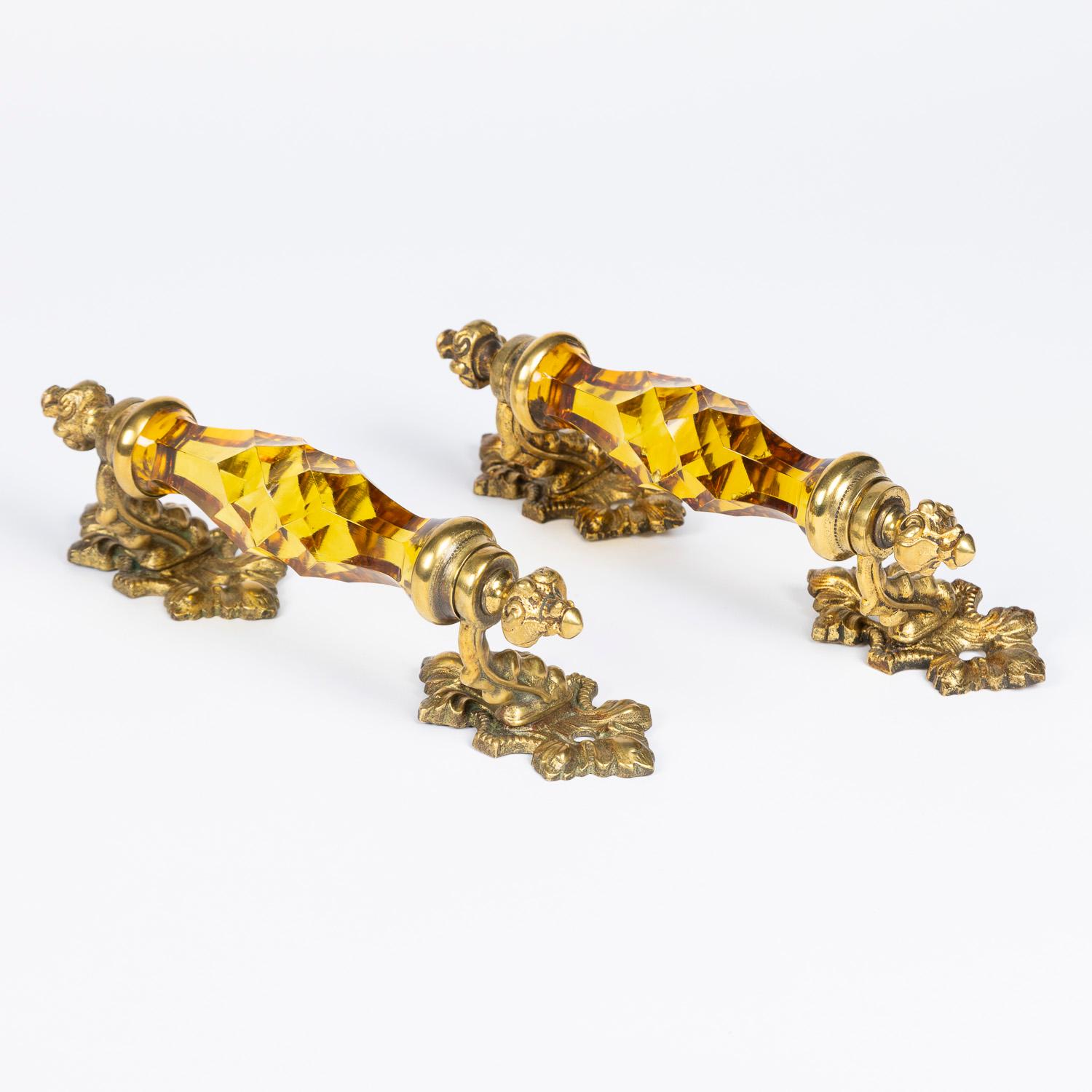 A pair of gilt brass door handles with amber coloured cut glass by James Cartland & Son of Birmingham, circa 1890.
 

See: James Cartland & Son catalogue, 1886, page 291.