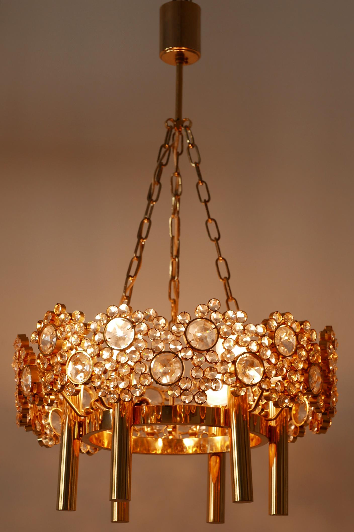 Elegant Mid-Century Modern chandelier or pendant lamp 'Jewel'. Designed and Manufactured by Palwa, 1970s, Germany. 

Executed in gilt brass, facet cut crystal glass, the chandelier needs 6 x E14 / E12 Edison screw fit bulbs, is with original wiring