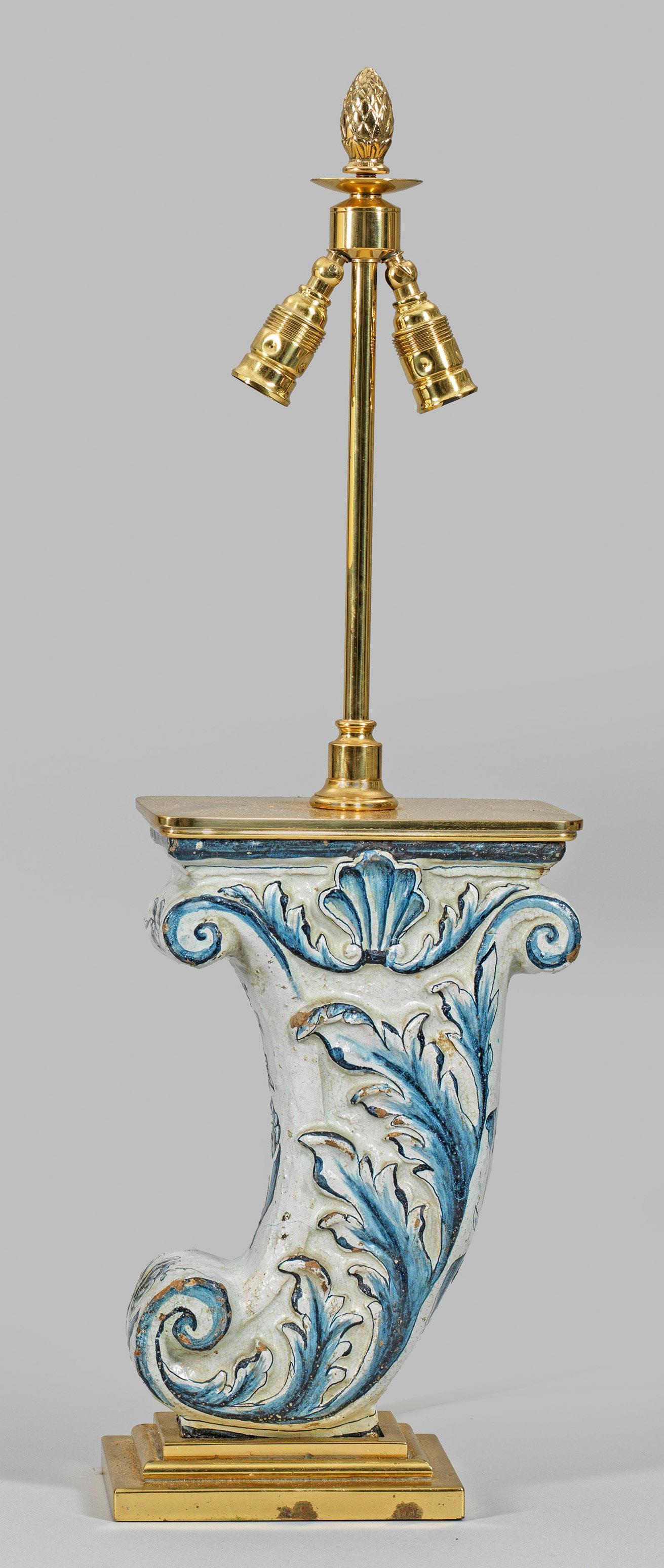 Anonymous
18th century and last half of the 20th century; Hamburg, Germany
Polychrome faience and gilt brass

Approximate size, including shade: 26 (h) x 6 (w) x 4 (d) in.

A unique custom-made gilt brass table lamp fitted with an 18th century