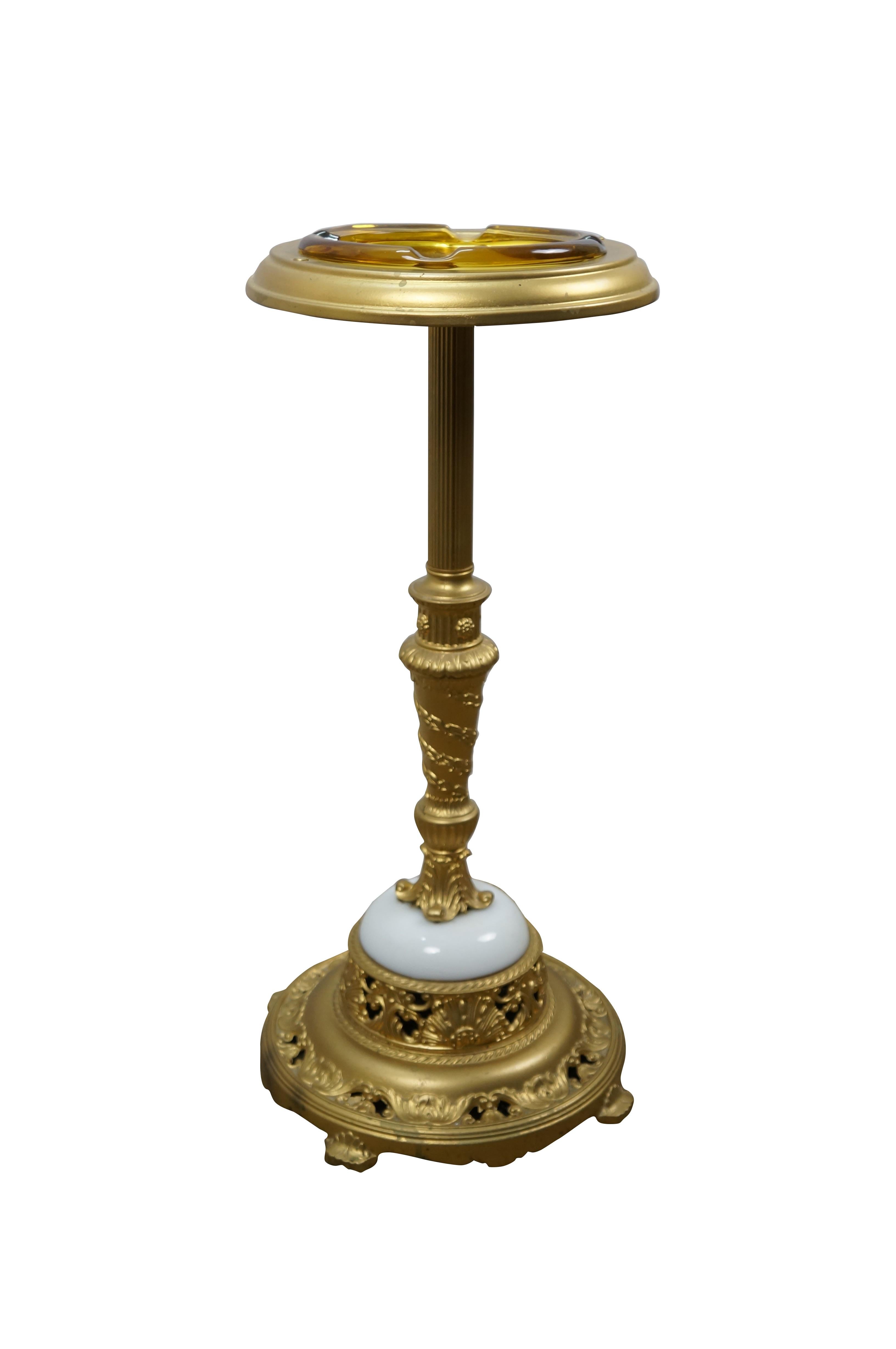 Circa mid 20th century gold painted smoking stand / floor standing ashtray - round base with foliate and scallop details and a white marble half orb supporting a torch shaped neoclassical inspired pillar wrapped in laurels, leading to a fluted