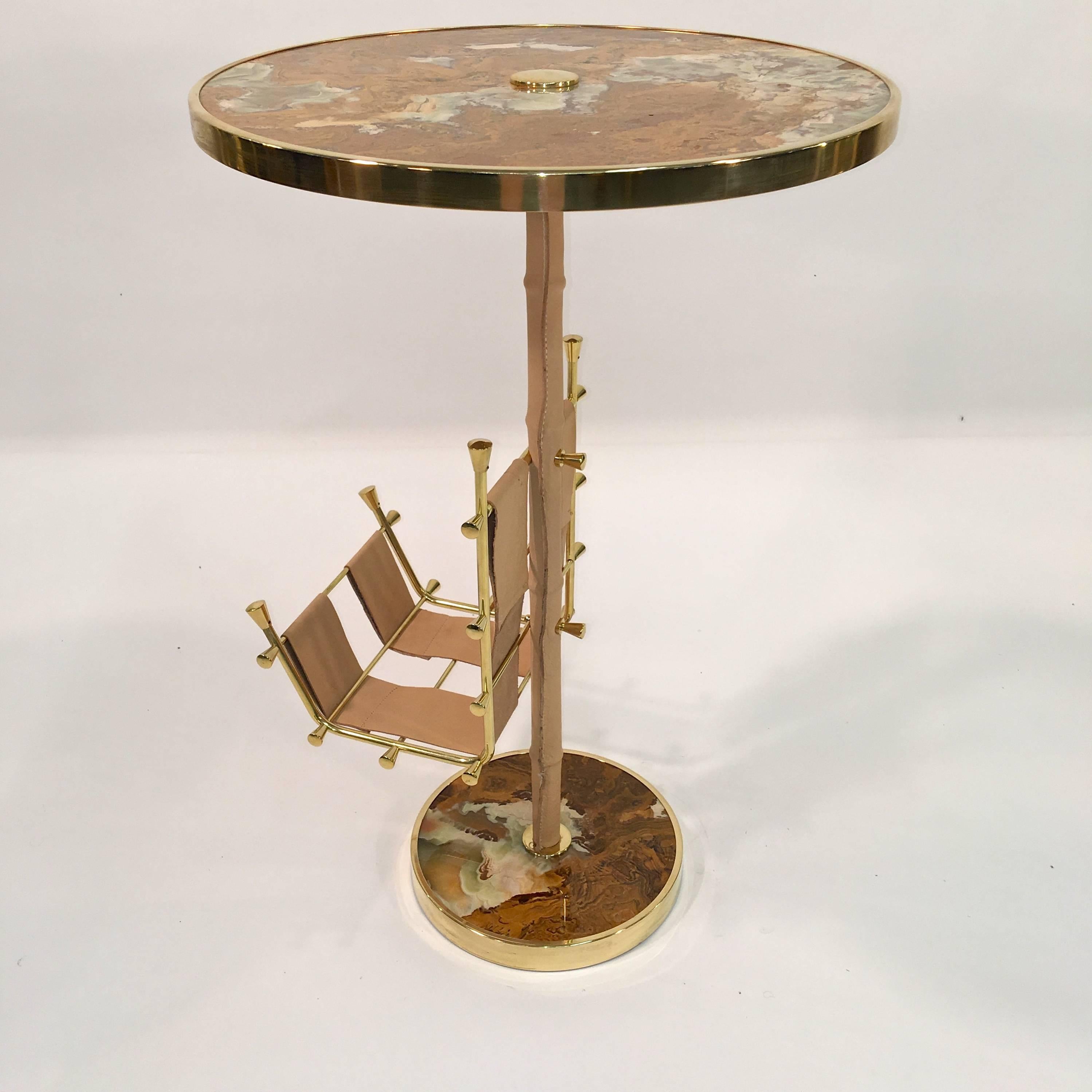 This table is a prototype created by our own artisans, inspired by 1950s French and Italian design.

The round top and base are polished onyx within a ring of 24-karat gold plated brass. The gilt brass will not tarnish.

On the bamboo-form brass