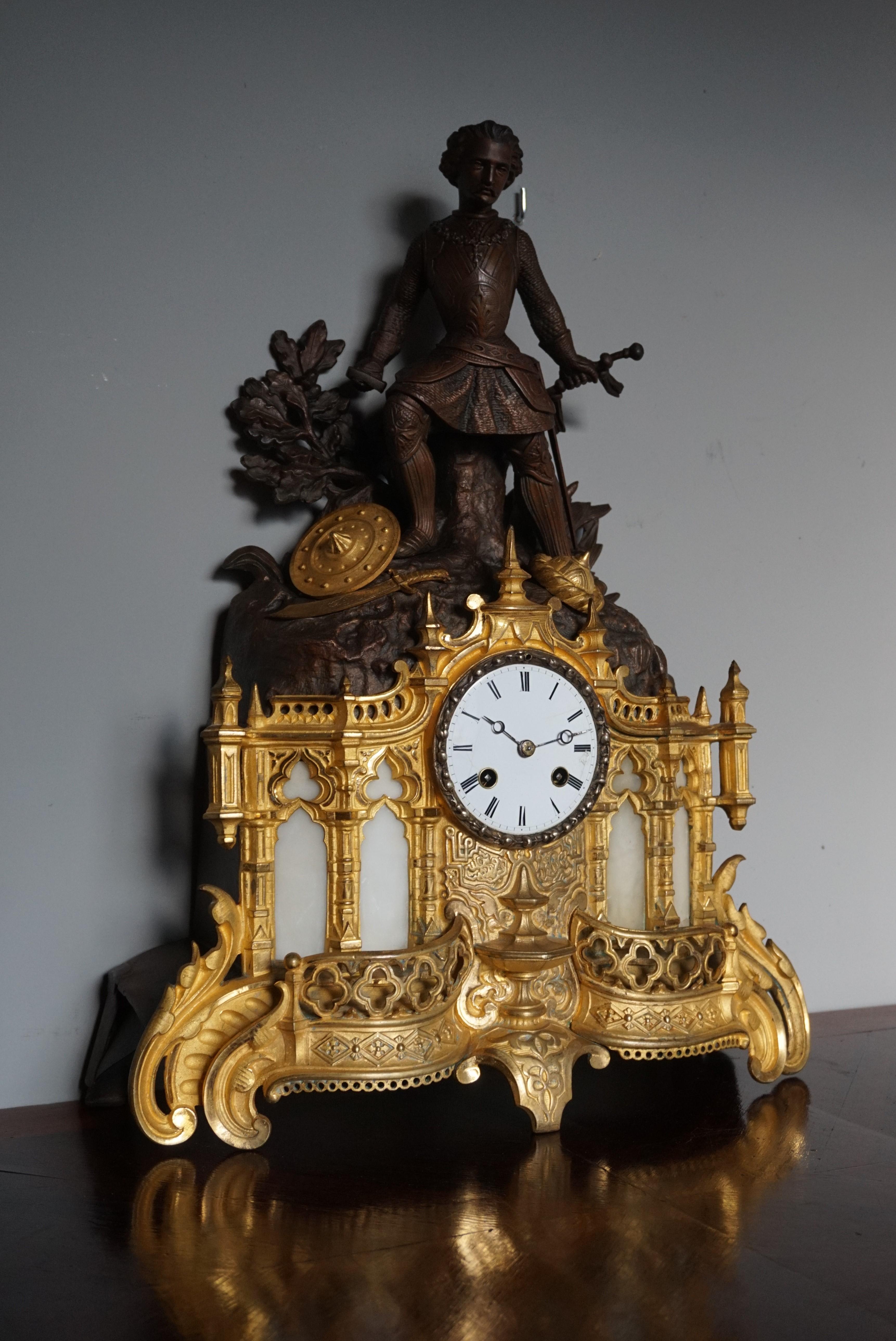 Cathedral design, sculptural gilt bronze and zinc clock.

This sizable, handcrafted, impressive and meaningful clock comes with a variety of Gothic church elements. As a matter of fact, the bottom half of this mantle clock very much resembles the