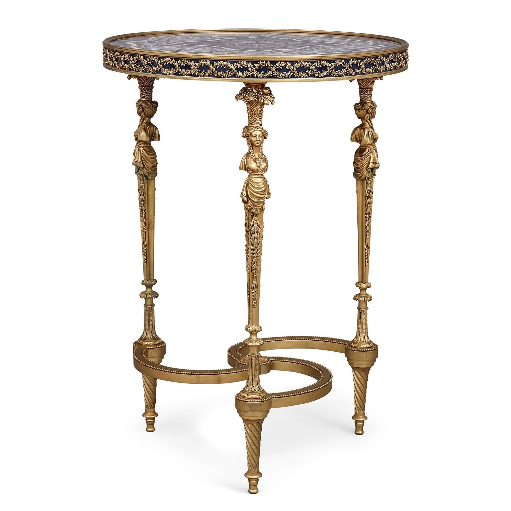 Mesa auxiliar circular estilo Luis XVI de bronce dorado y amatista
Francés, finales del siglo XIX
Medidas: Altura 73 cm, diámetro 52 cm

Esta excepcional mesa auxiliar circular es un magnífico ejemplo del neoclasicismo francés del siglo XIX,