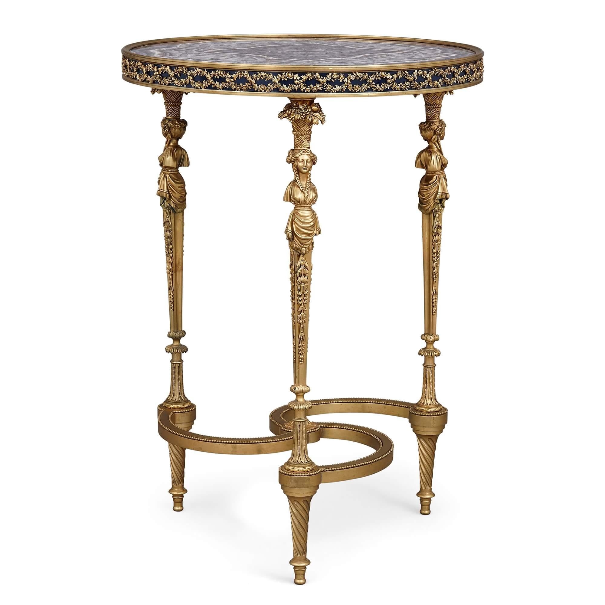 Gilt bronze and amethyst Louis XVI style circular side table
French, late 19th century
Measures: Height 73cm, diameter 52cm

This exceptional circular side table is a superb example of nineteenth-century French neoclassicism, drawing as it does