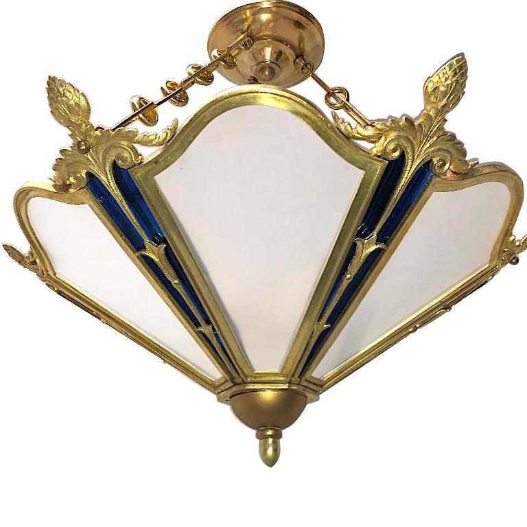 A circa 1920's French gilt bronze light fixture with frosted glass and cobalt blue mirror with interior lights.

Measurements:
Drop: 23