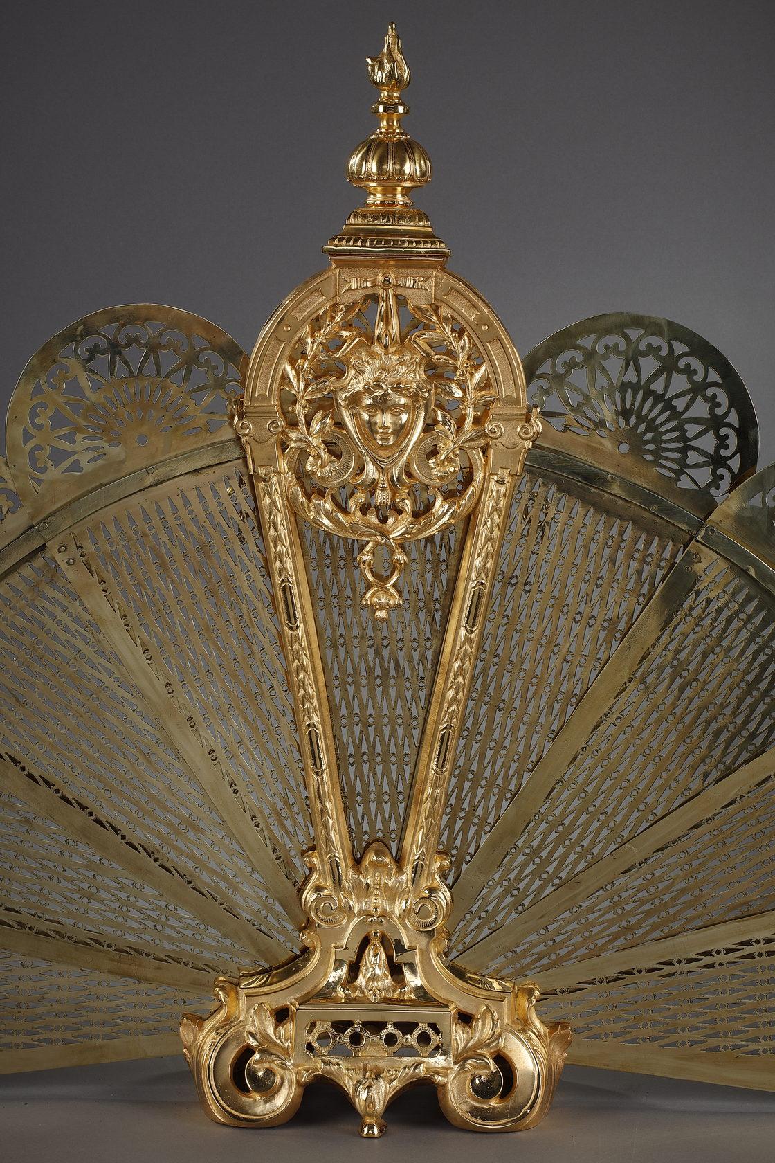 Gilt bronze and chased fan-shaped fire screen with female face decoration 2