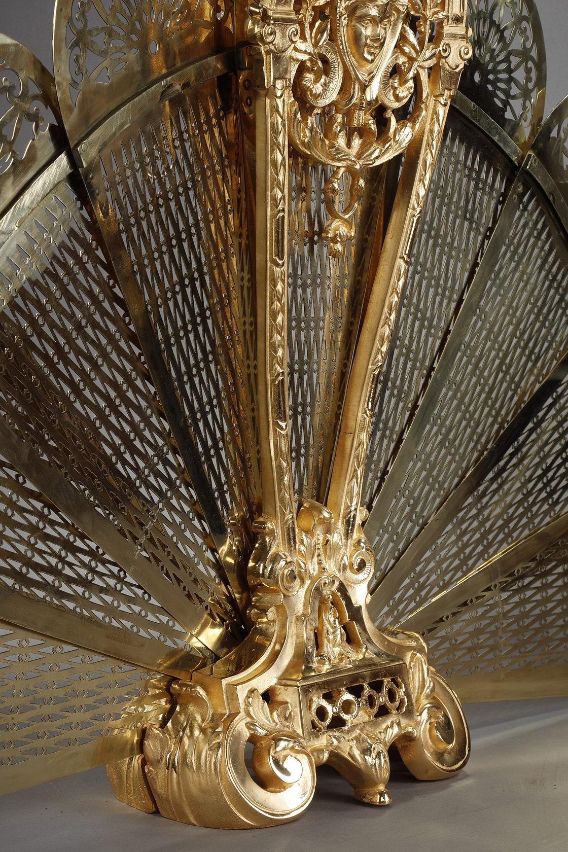 Gilt bronze and chased fan-shaped fire screen with female face decoration 6