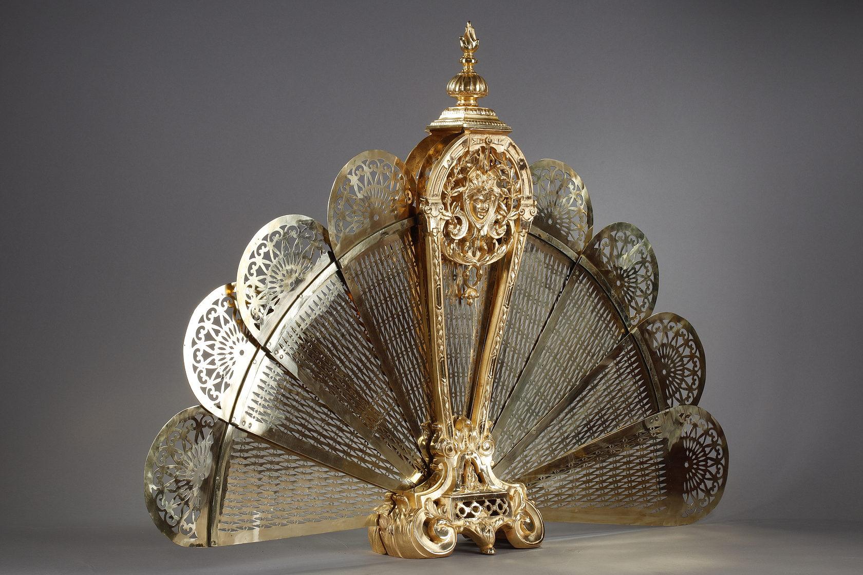 Gilt bronze and chased fan-shaped fire screen with female face decoration 8