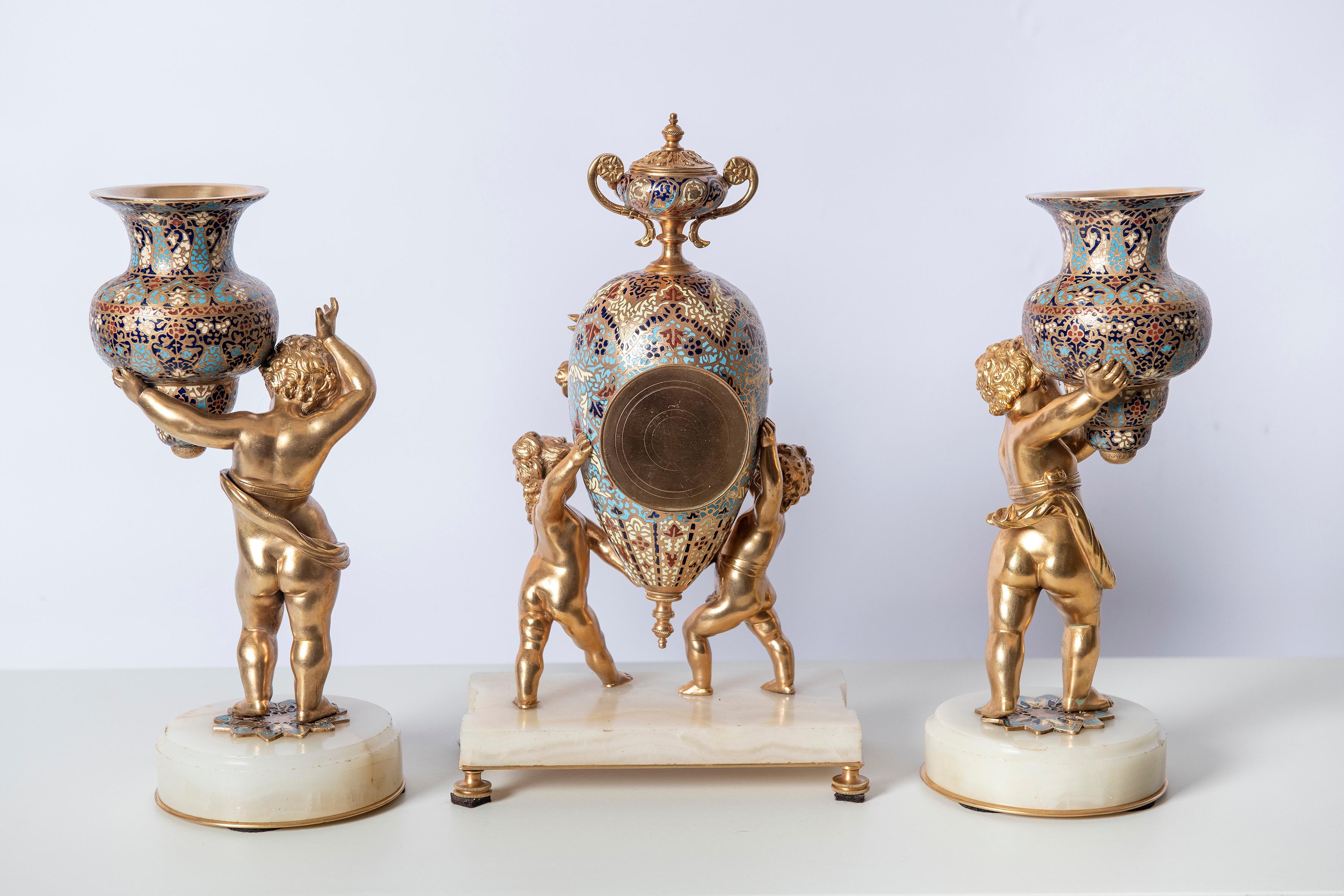 Gilt-bronze and cloisonné garniture with angels figures, France, 19th century.