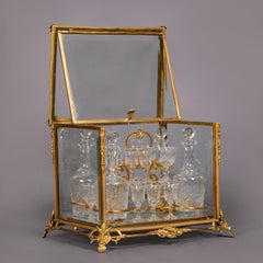 Juego de decantador de bronce dorado y cristal tallado de Baccarat