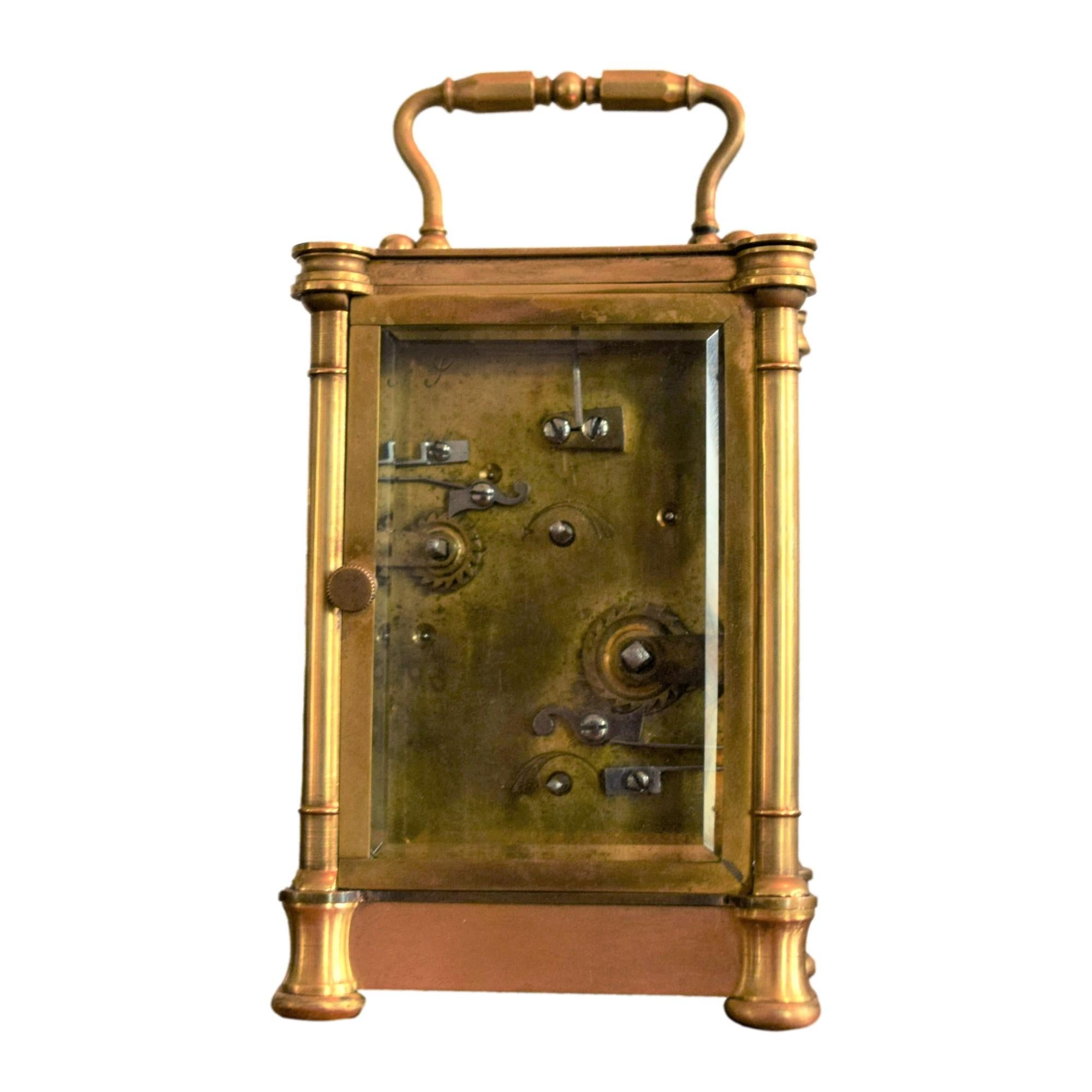 

A charming officer’s clock in gilt bronze and crystal, presented in its box.

The clock is finely chiseled with a decoration of scrolls and bunches of grapes, framed by fluted pilasters with a fine band of arabesque on the upper and lower