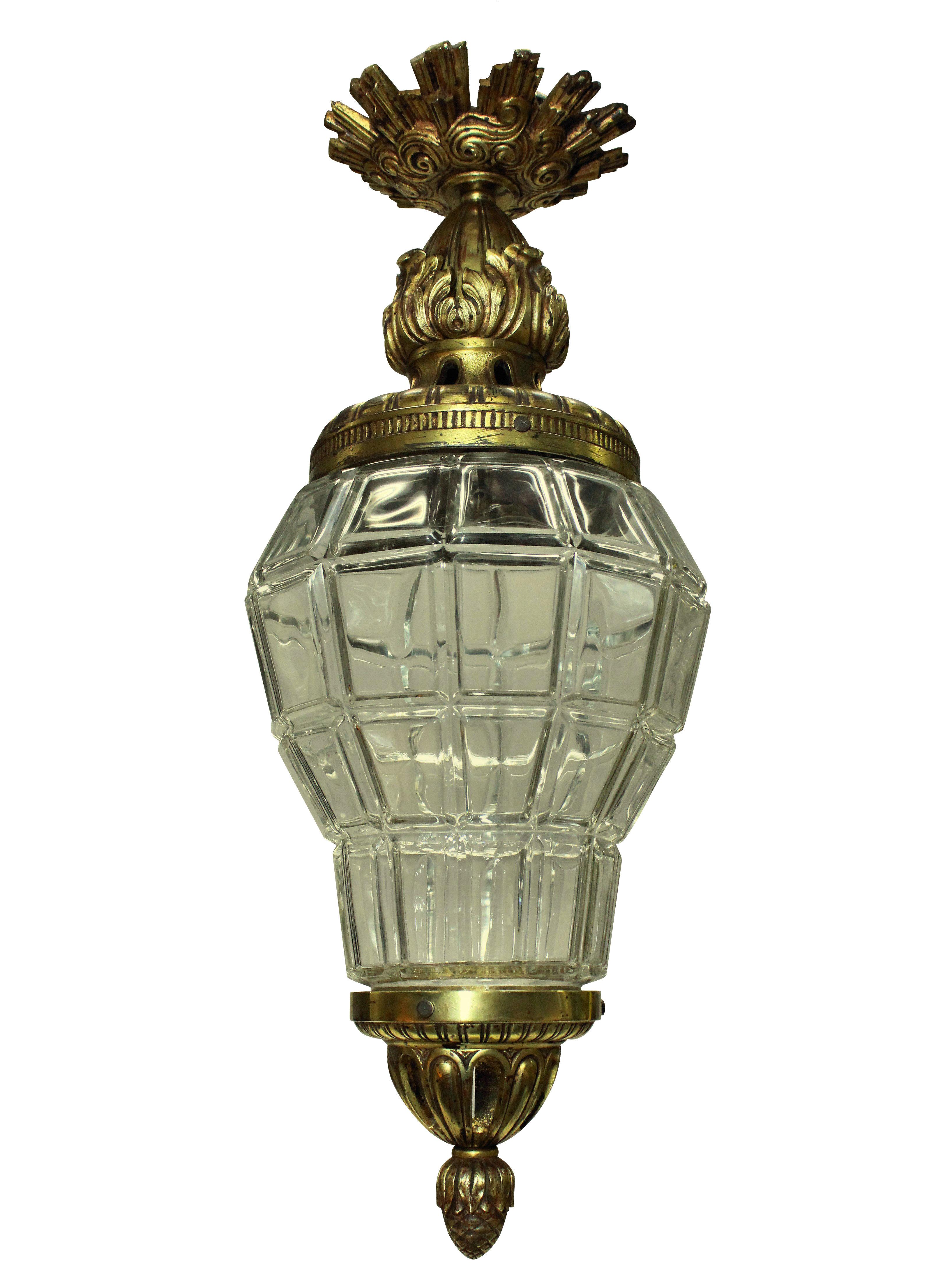 A French gilt bronze and glass lantern, modelled on the lanterns at Versailles, the canopy having sun rays.