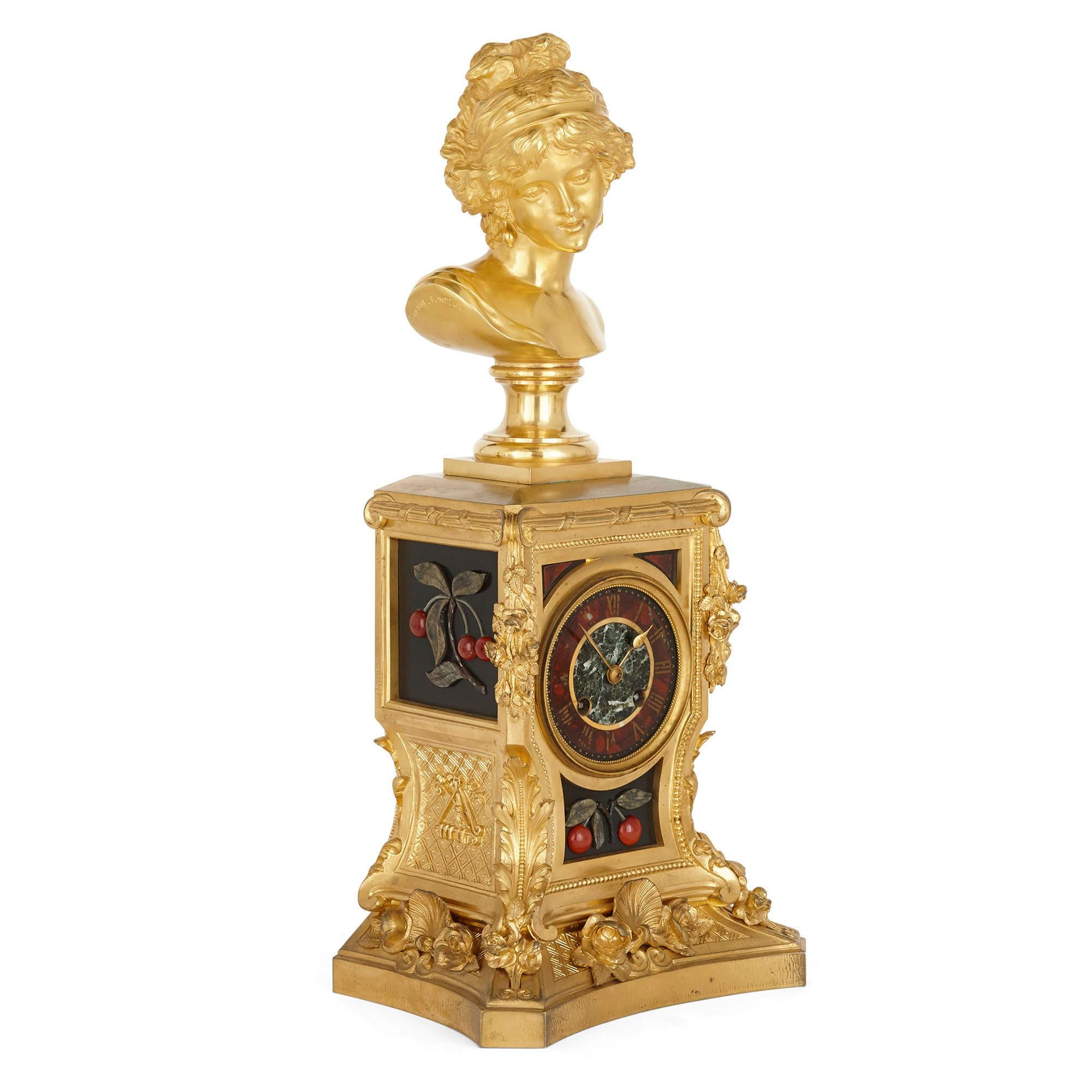 Gilt bronze and hardstone inlay Napoleon III period clock set by Barbedienne
French, 19th century
Measures: Clock: Height 50cm, width 23cm, depth 16cm
Candelabra: Height 49cm, width 19cm, depth 19cm

This stunning clock set expertly showcases