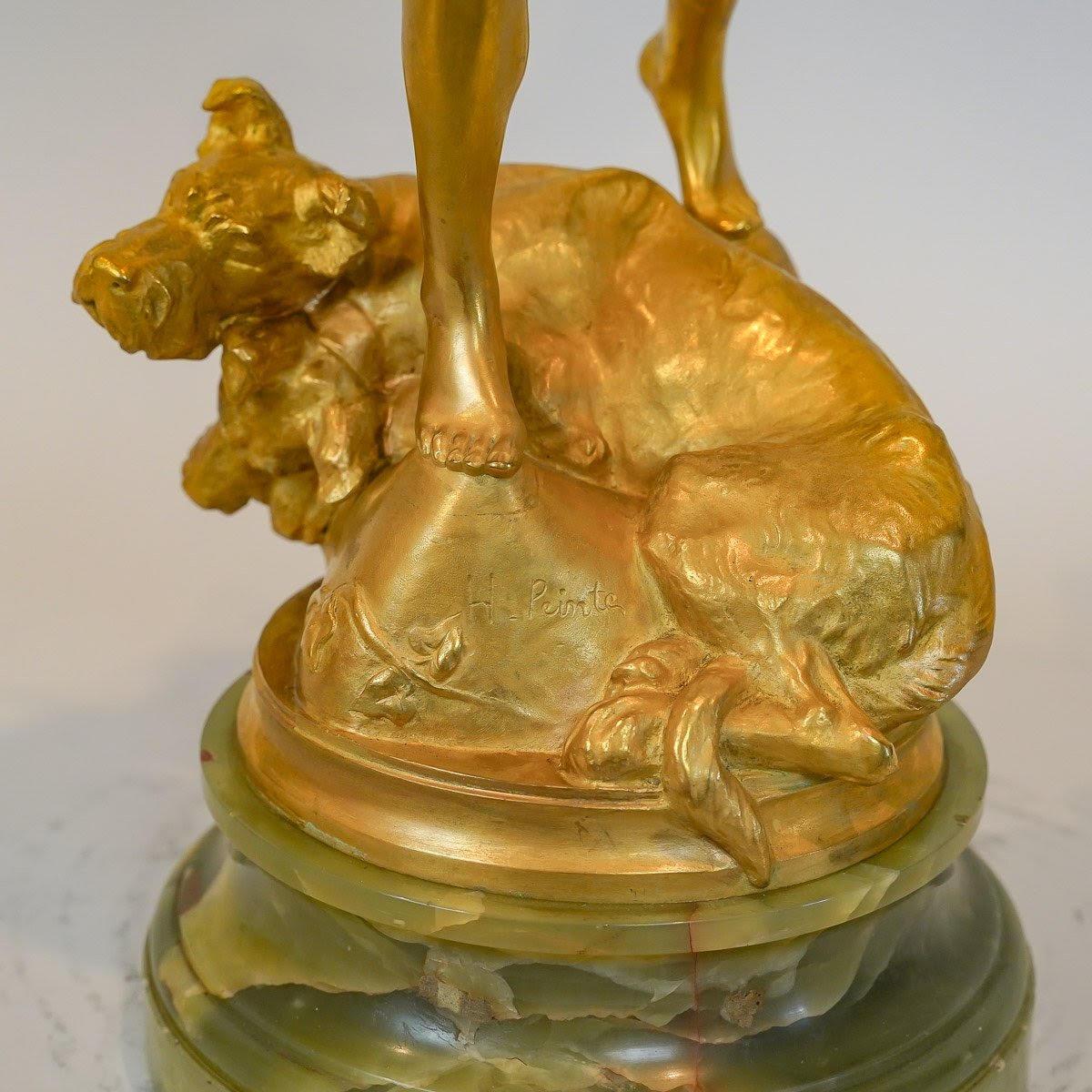 Escultura de bronce dorado y ónice de Henri Peinte, 1900. Dorado