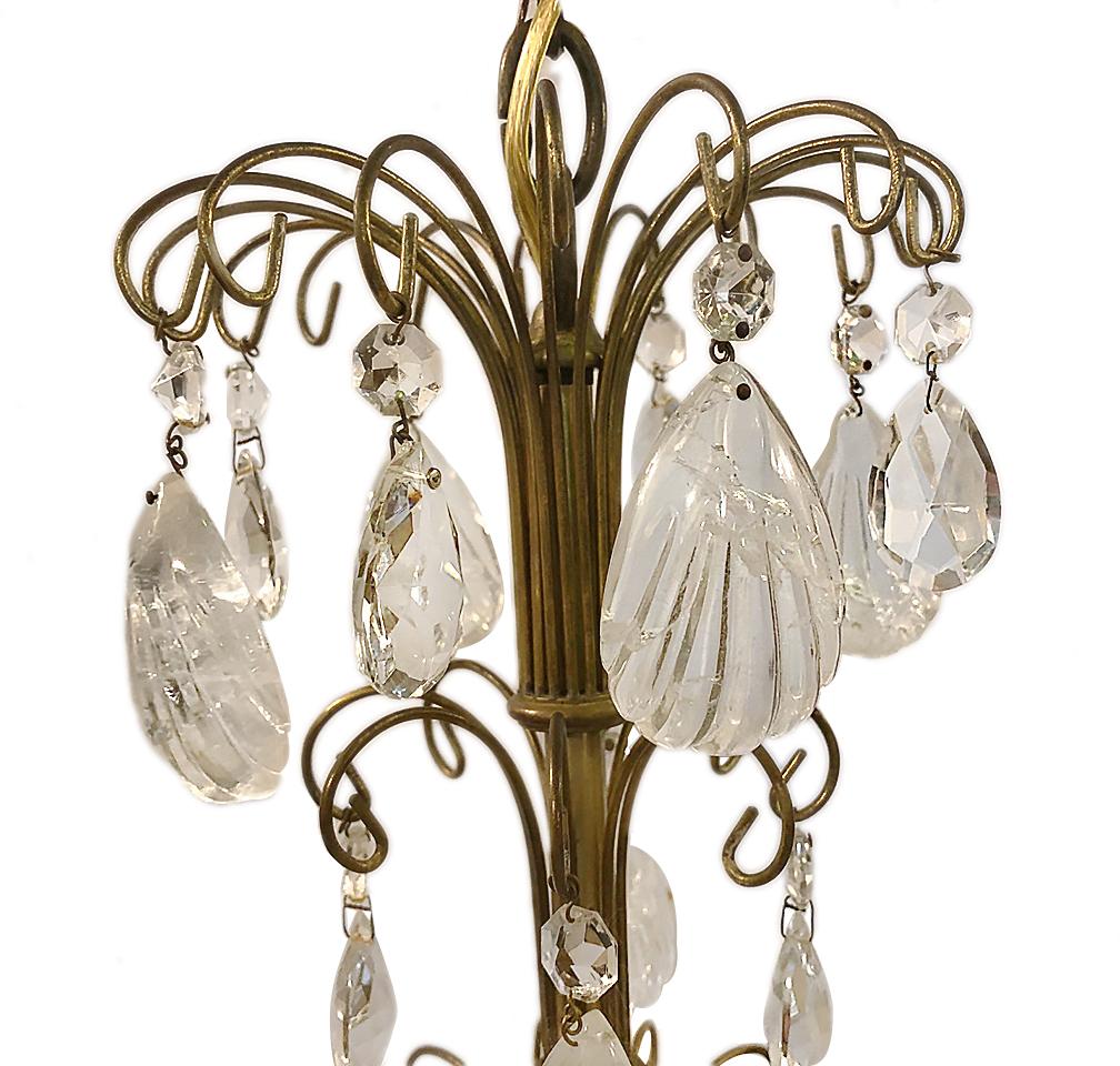 A circa 1920s French gilt bronze chandelier with crystals and rock crystals.

Measurements:
Height 24.5