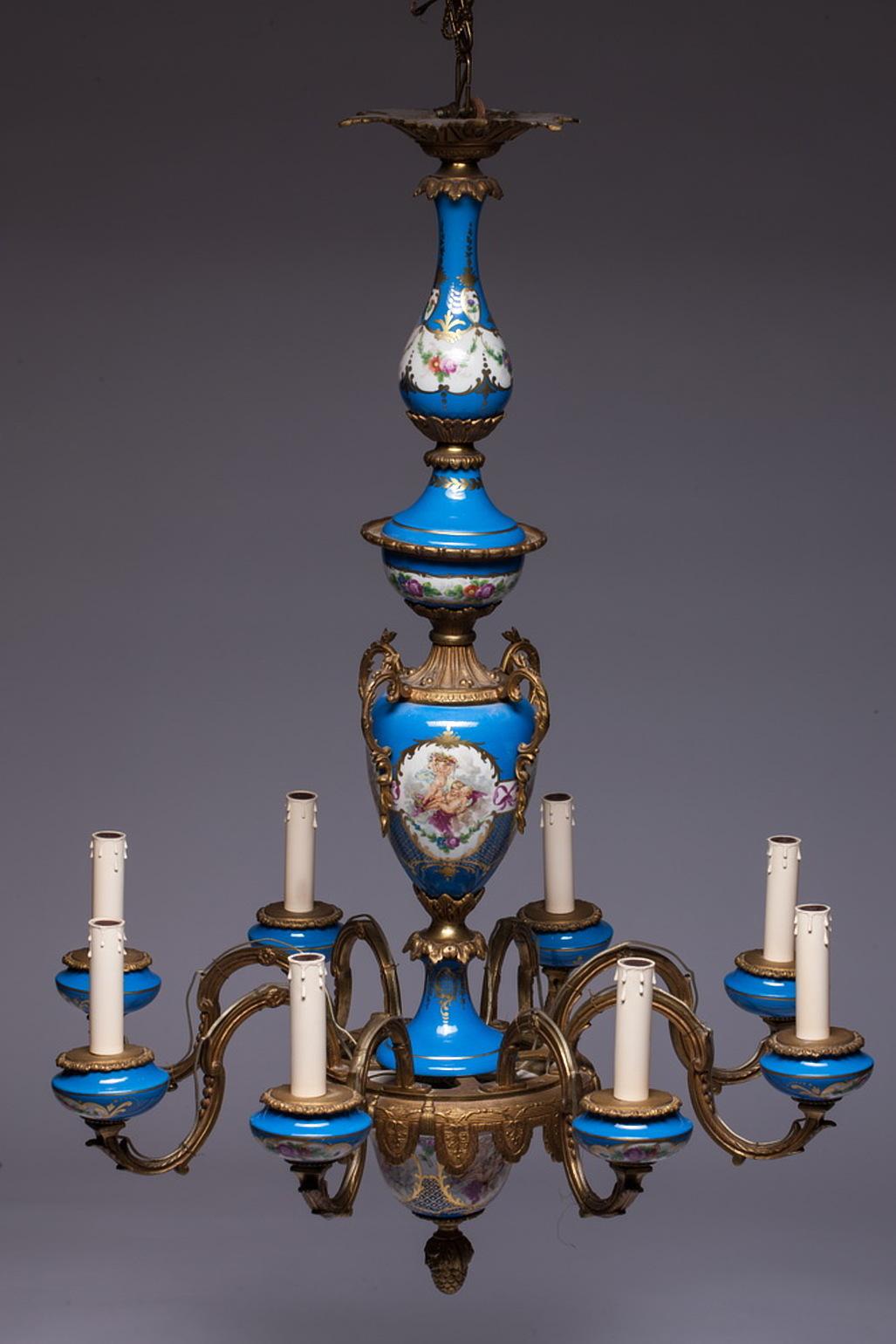 French chandelier with a painted and glazed porcelain in the Sèvres style with gilt bronze armature with eight arms.

